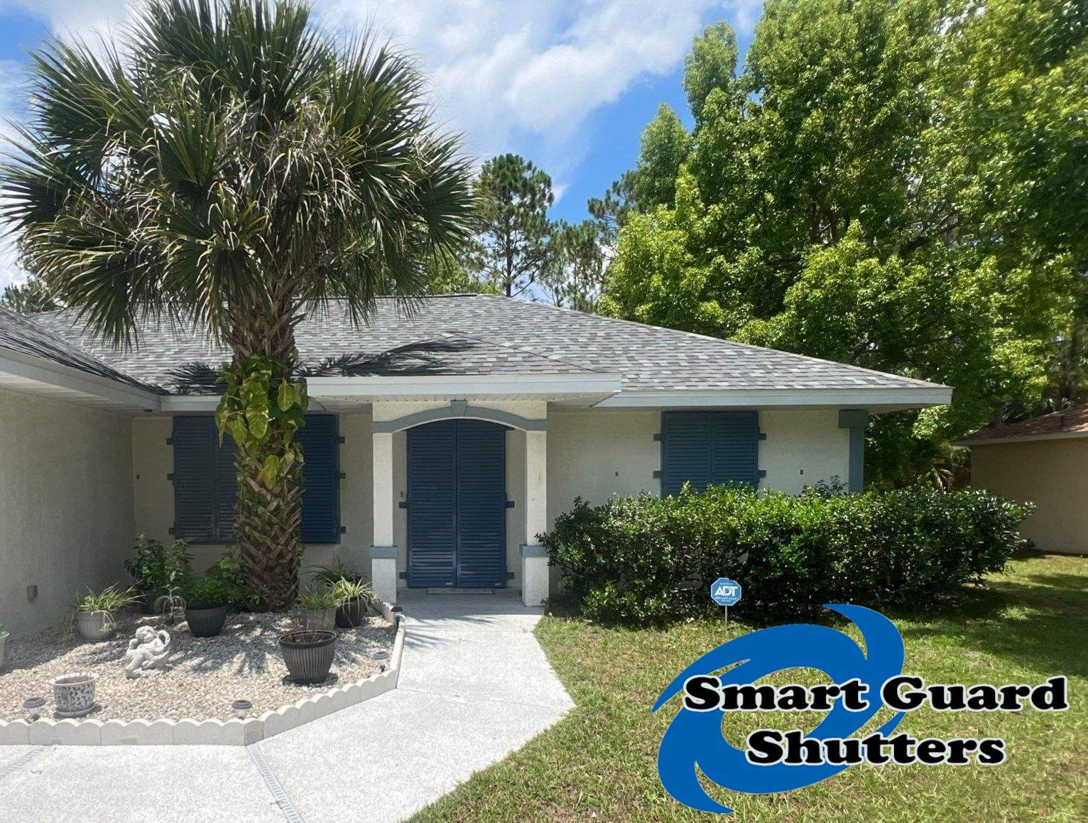 Impact Rated Colonial Shutters in Pigeon Blue by Smart Guard Shutters