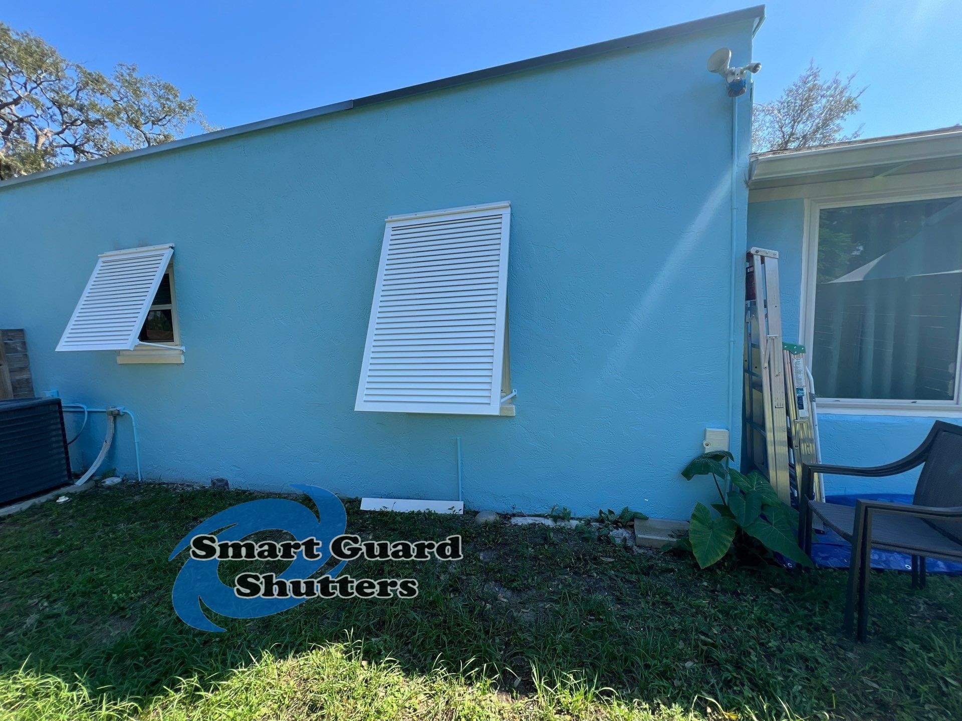 Decorative Bahama Shutters in Signal White  by Smart Guard Shutters