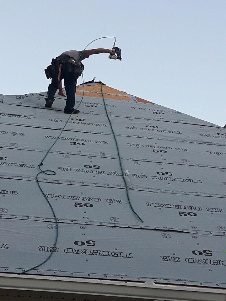 Residential Roofing Installation using Roof Replacement by American Roofing & Construction LLC