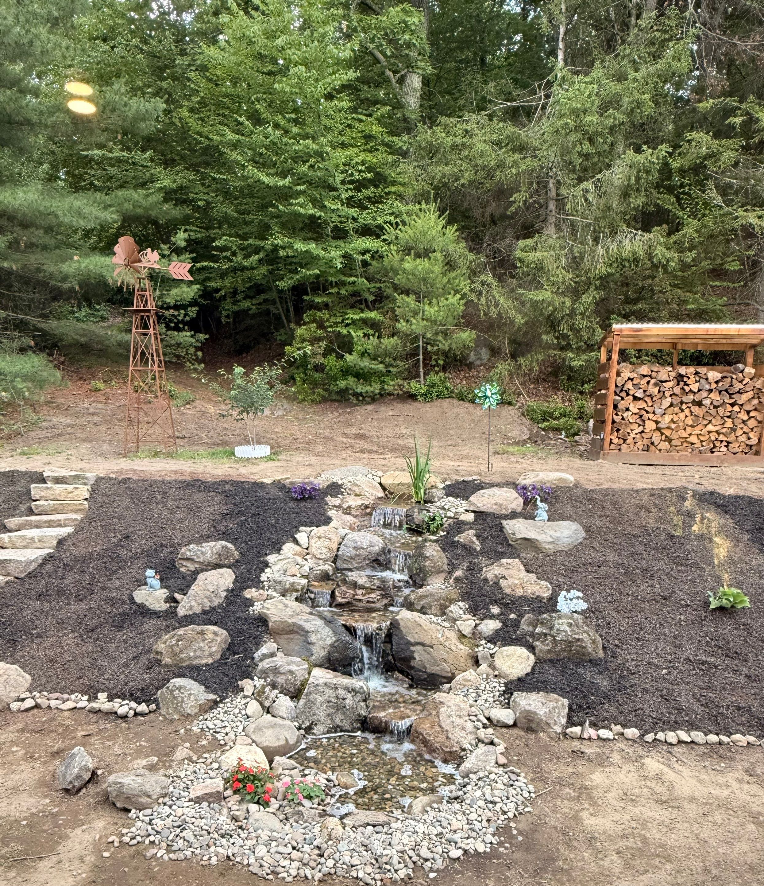 Complete Rebuild of a Pondless Waterfall in Palmer by Wicked Water Gardens