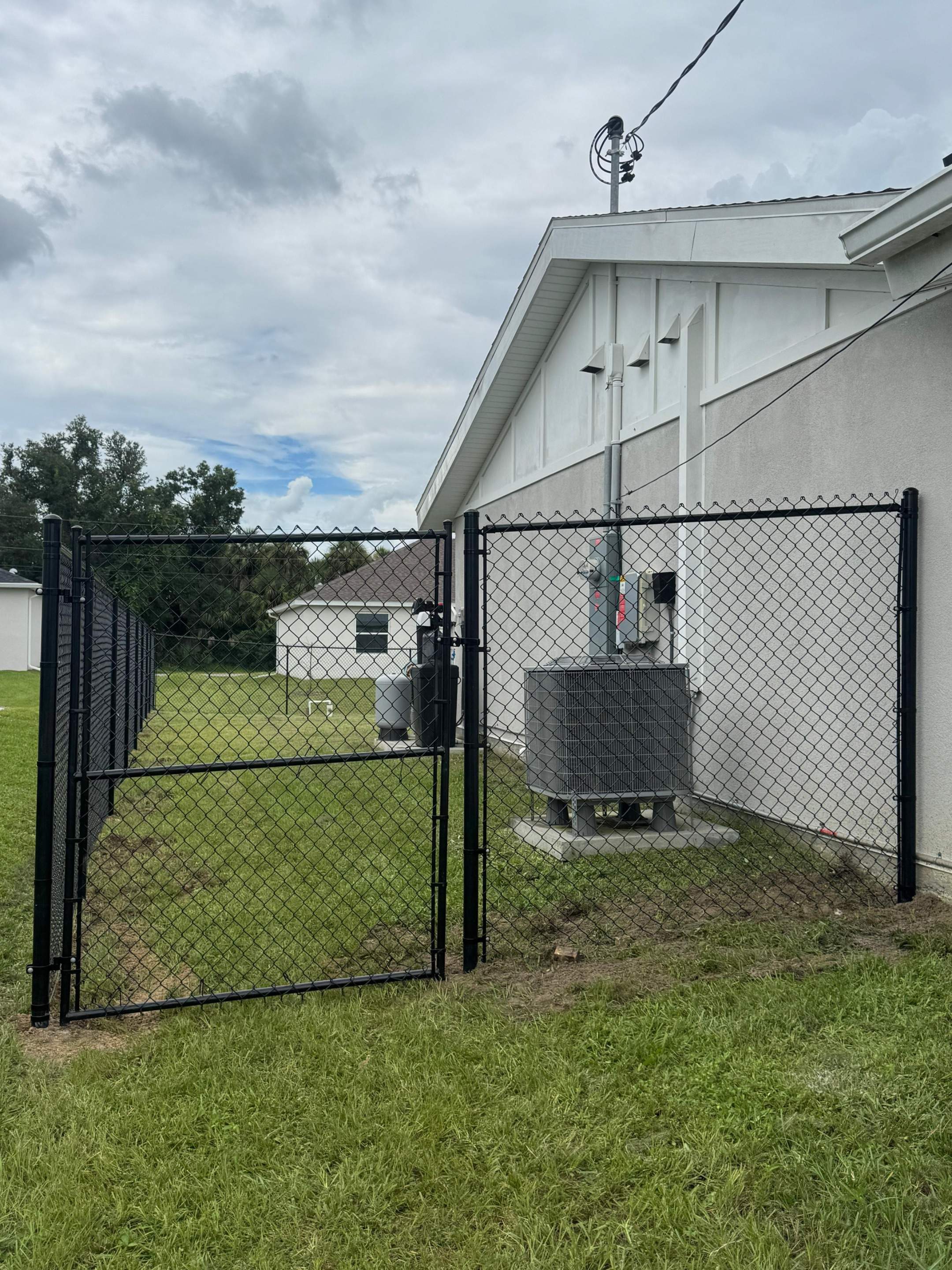 Residential Black Chain Link Fence Installation in North Port by True Fence LLC