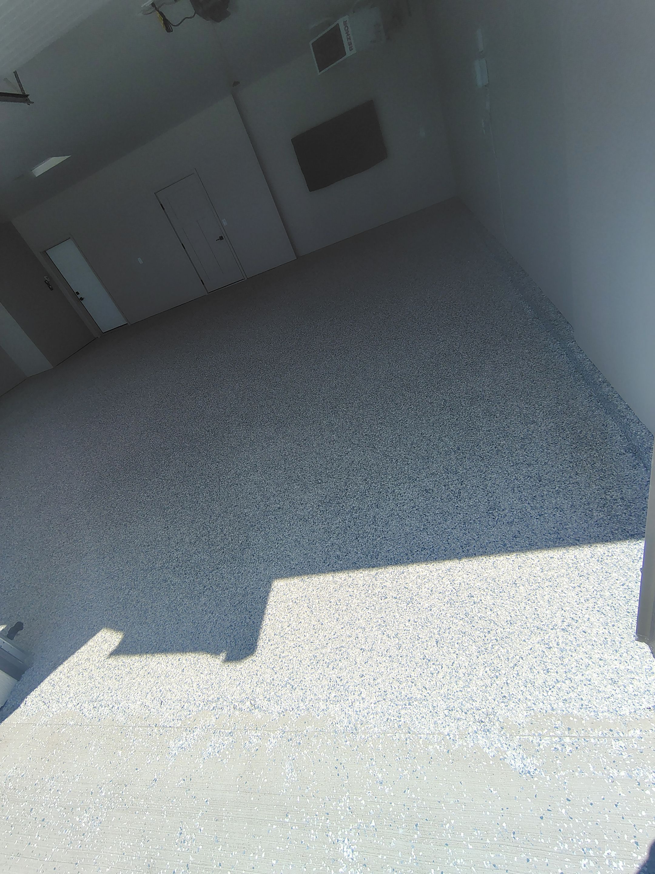 Full Speckled Concrete Coating for Sioux Falls Garage by Select Painting, Coatings & Garage Cabinets