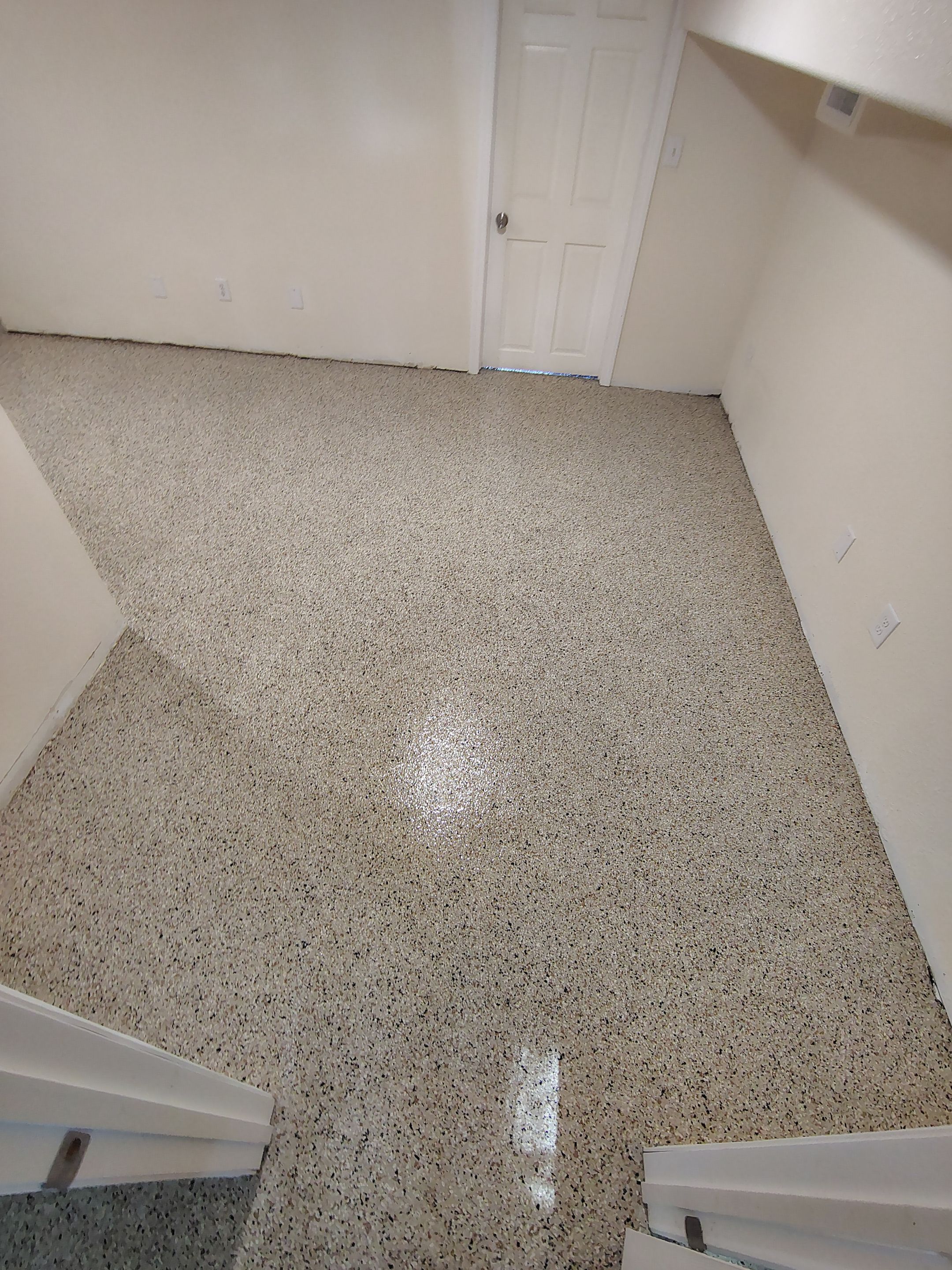 Comprehensive Basement Concrete Floor Coating and Crack Repair in Sioux Falls by Select Painting, Coatings & Garage Cabinets