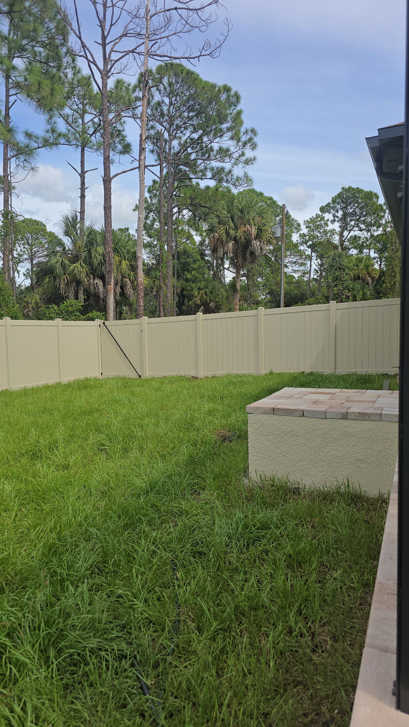 Tan Vinyl Privacy Fence and Gate Installation in Port Charlotte by True Fence LLC