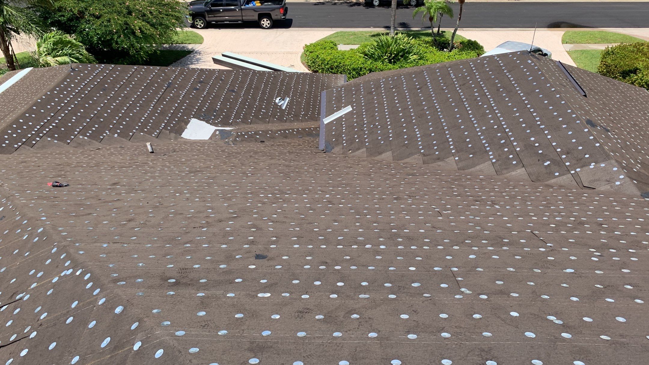 Residential Roofing Installation using 1" Nail strip metal roof by BLUES BROTHERS ROOFING