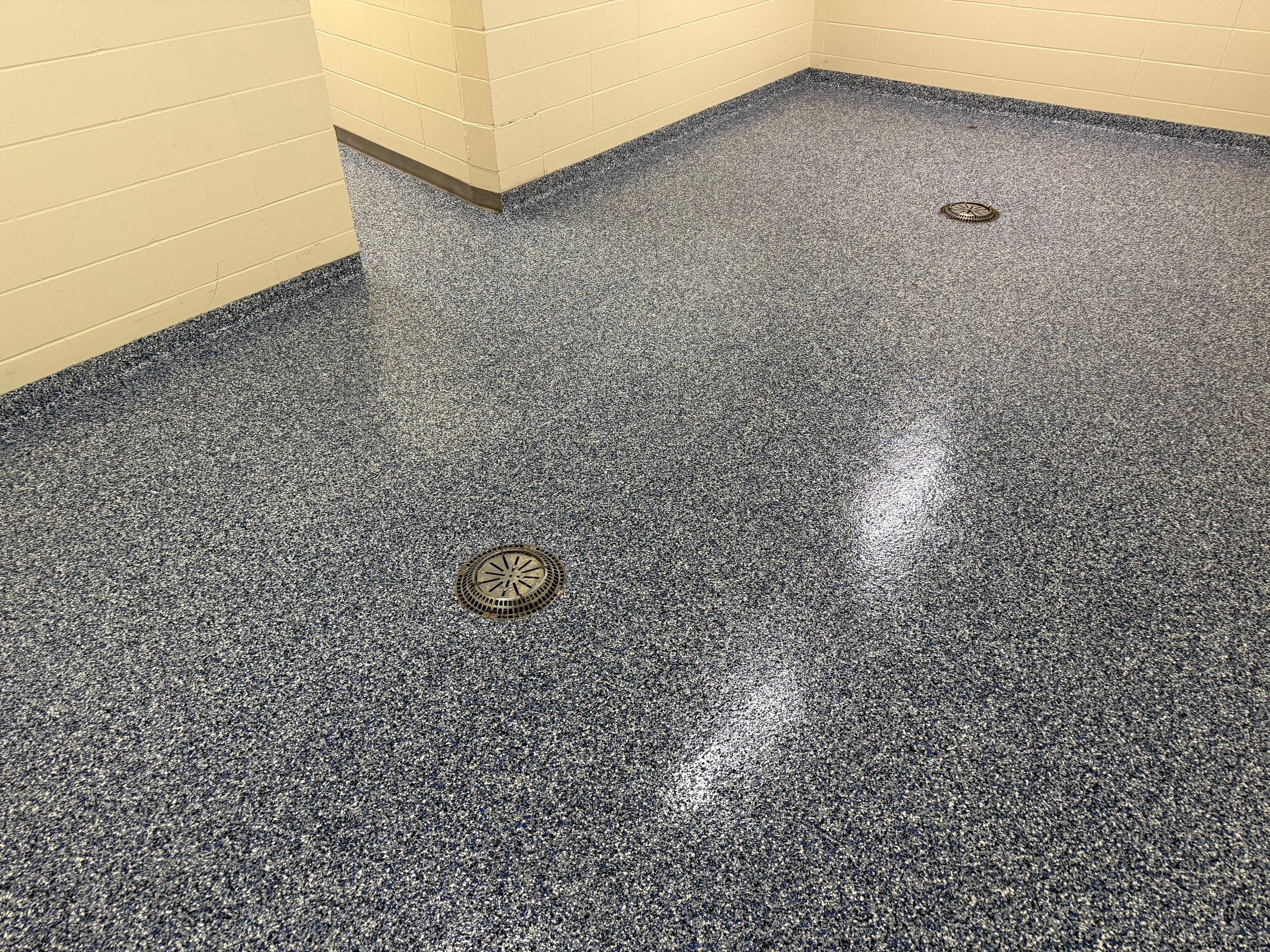 Seamless Epoxy Floor Coating at the Sioux Falls Canaries Facility by Select Painting, Coatings & Garage Cabinets