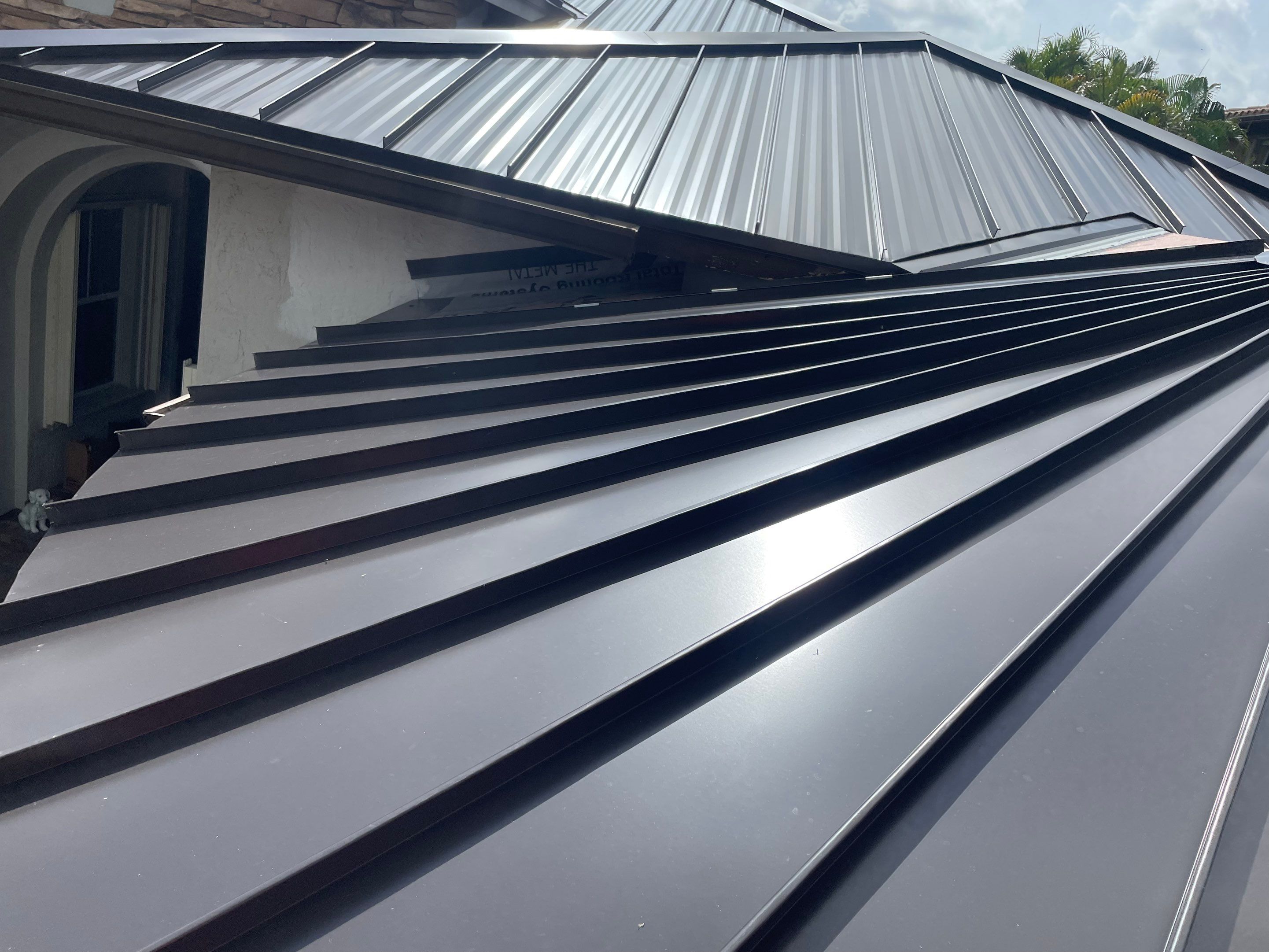 24ga 1.5" Mechanical Seam Dark Bronze by Total Roofing System The Metal Roof Experts