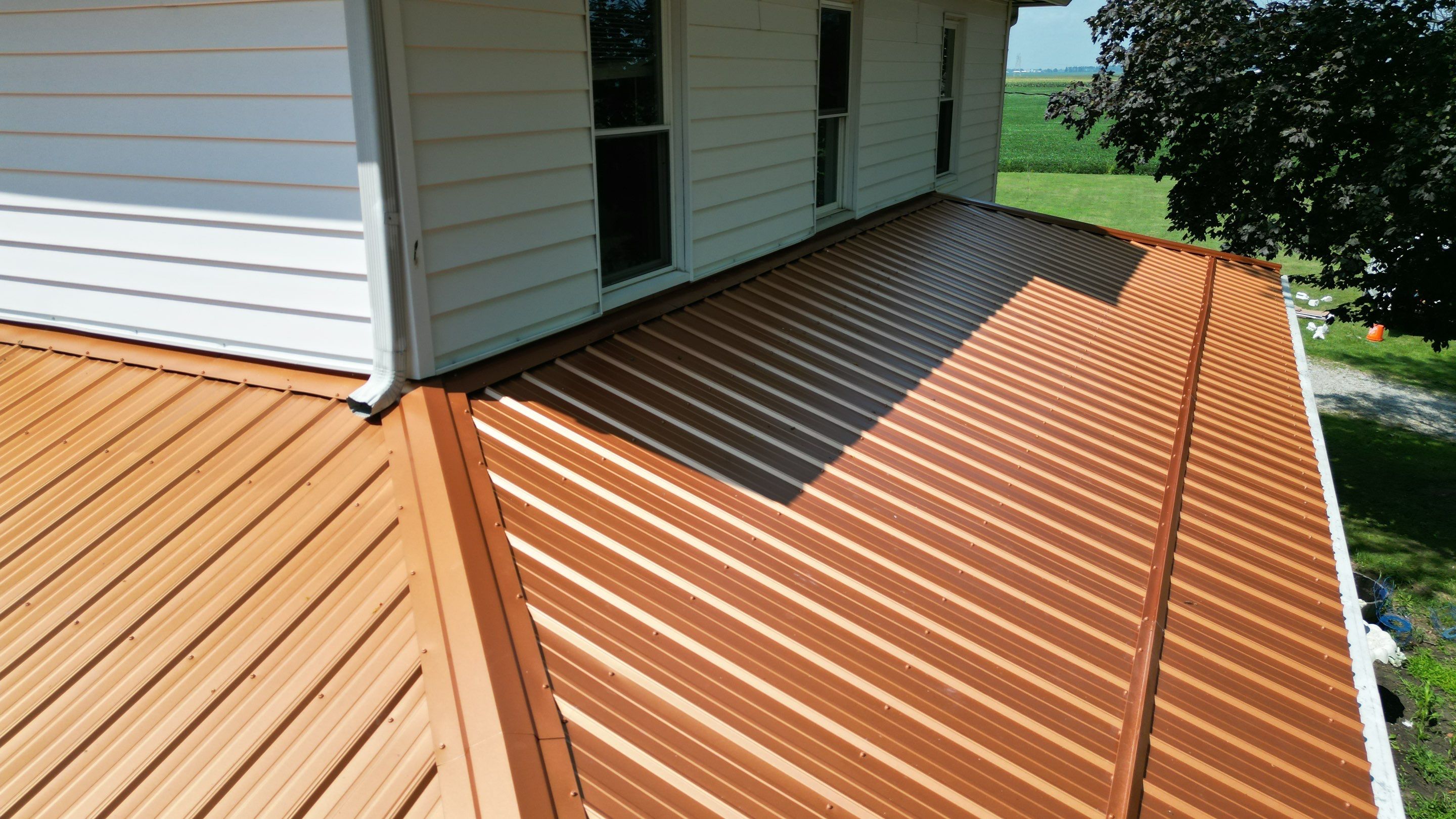 Residential Roofing Installation using Performance Panel Metal - Copper Metallic by RoofX 