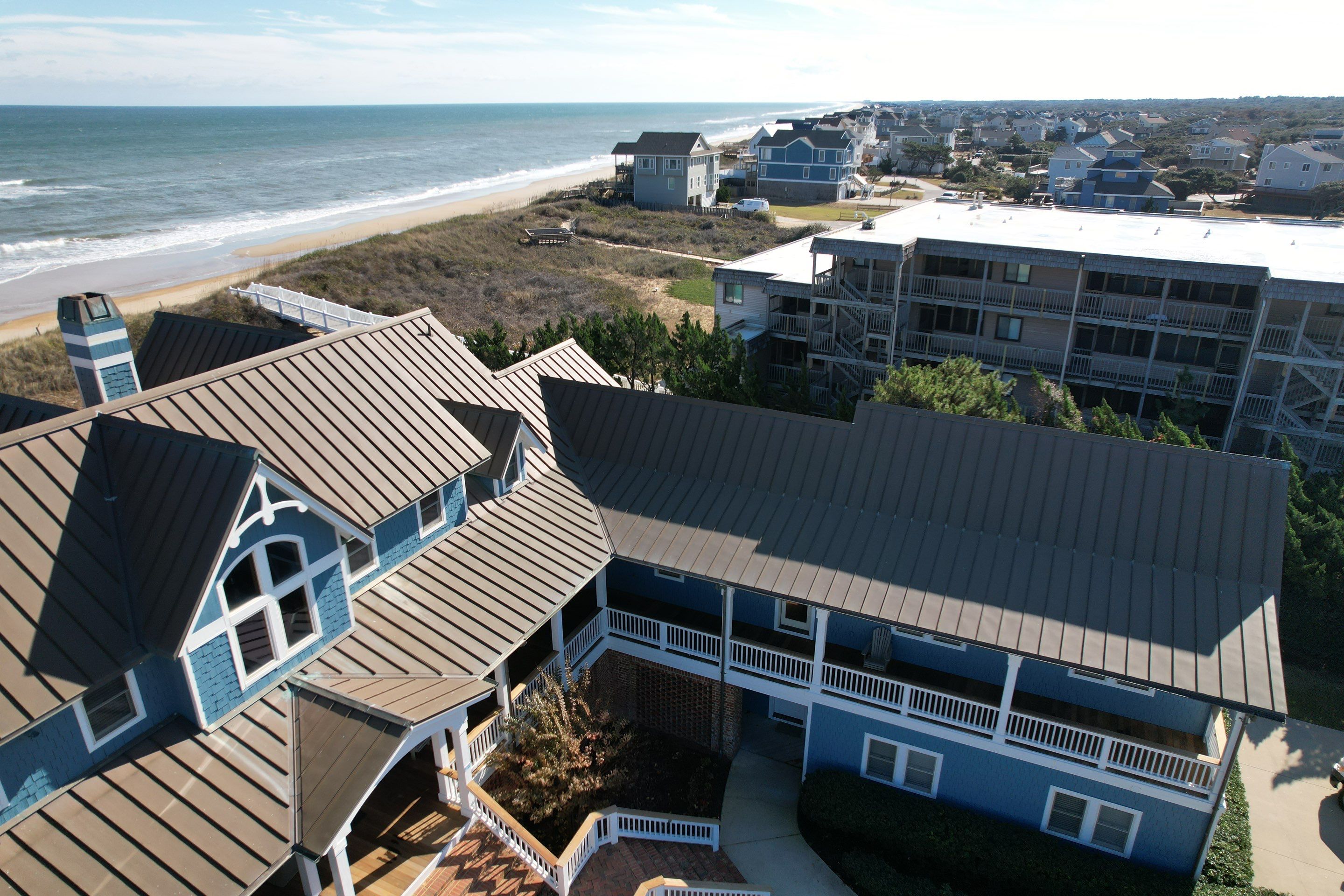 Large Metal Roof Transformation by Gallop Roofing & Remodeling, Inc.