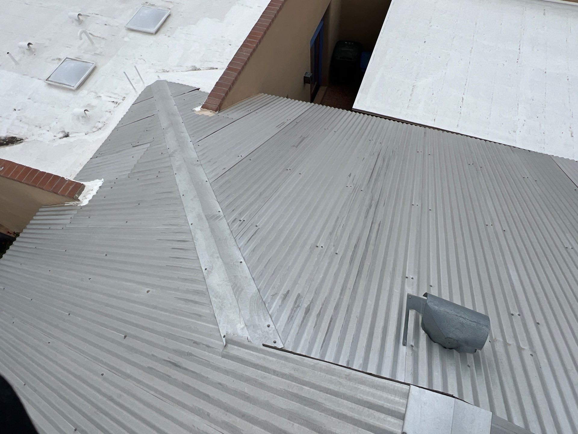 Metallic Silver Exposed Fastener by Reimagine Roofing