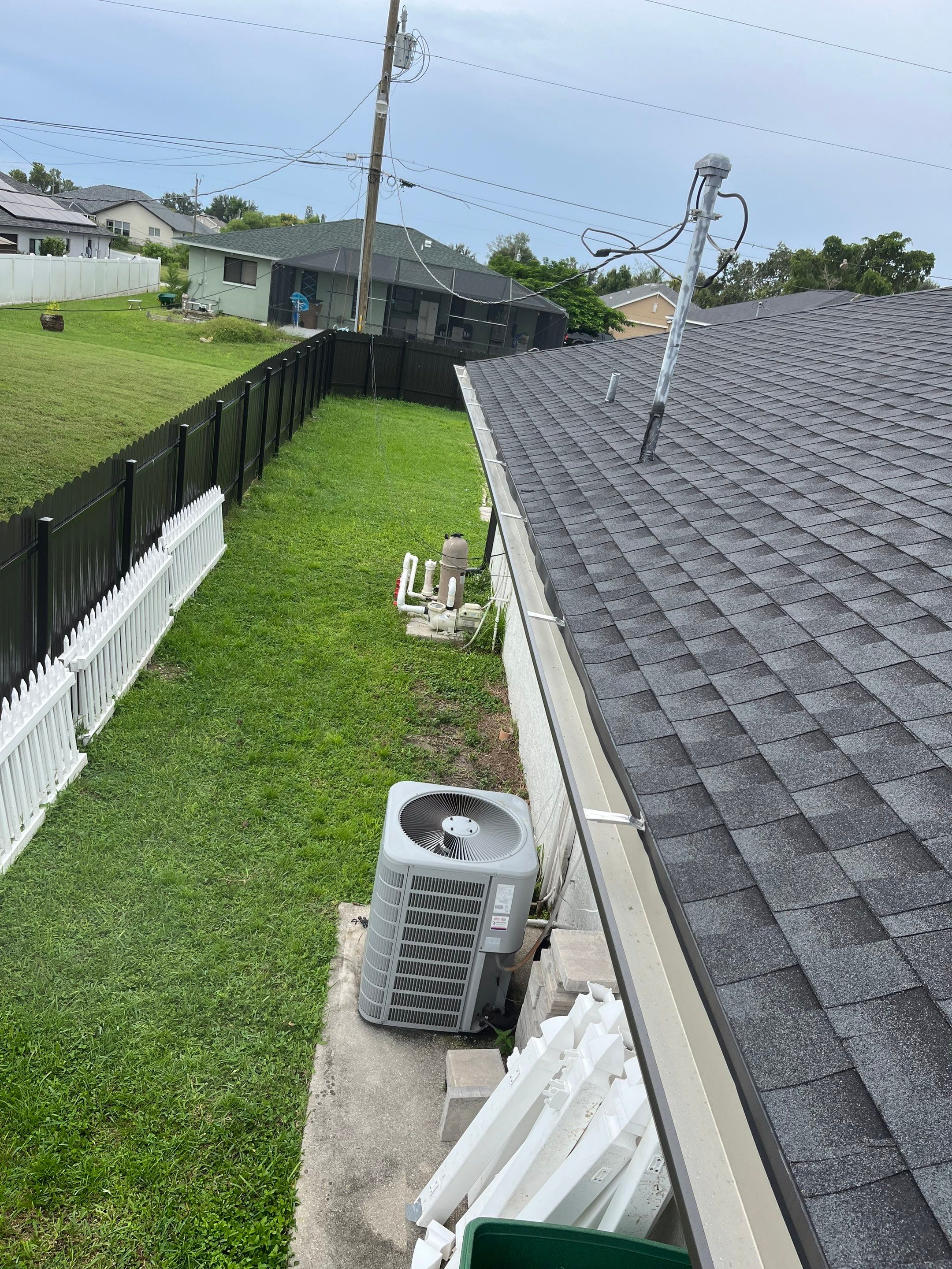 Black Seamless Gutters for a Modern Look in Cape Coral FL by Gutter Professors