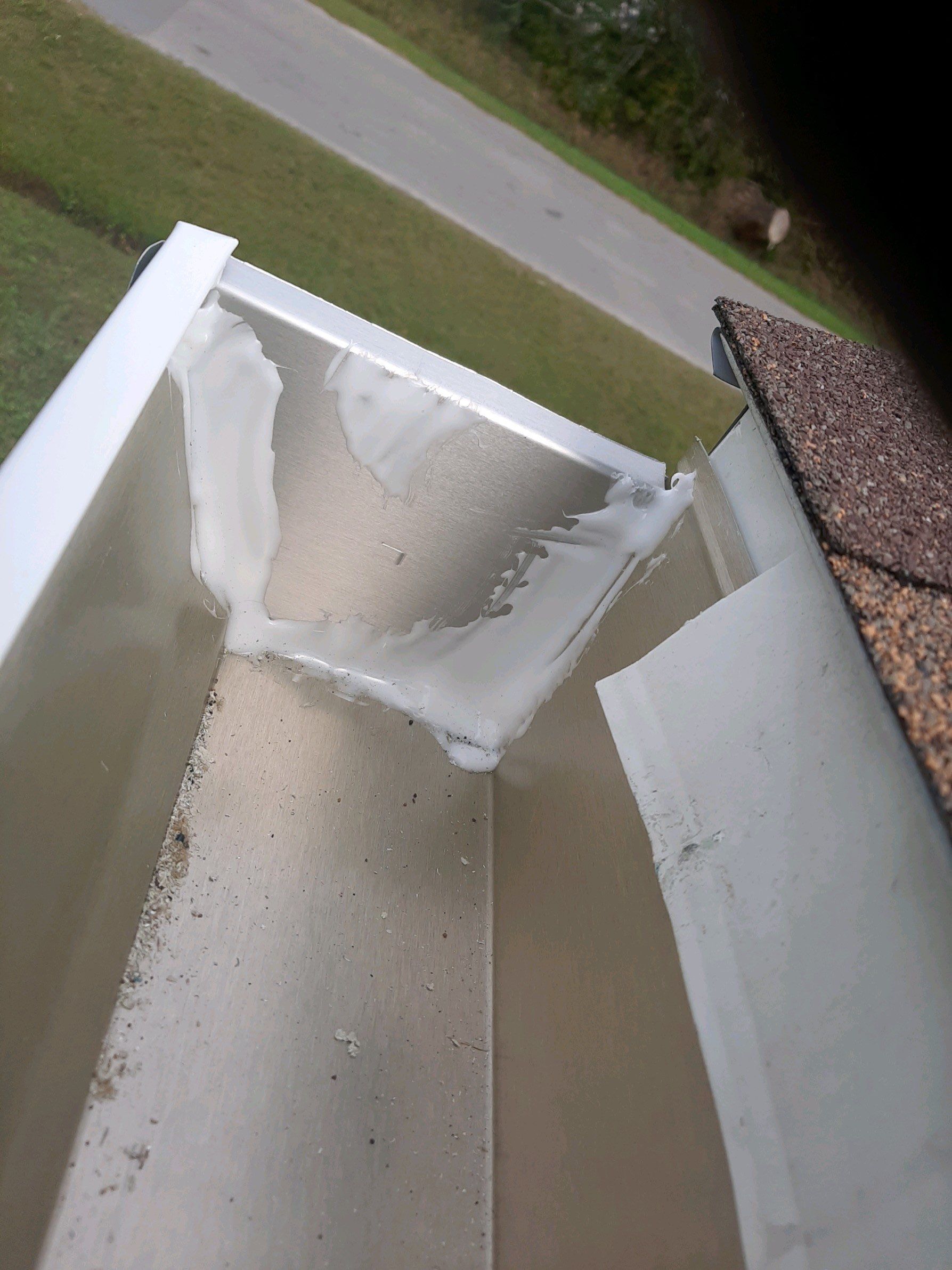Gutter Installation using White Seamless Gutters by Gutter Professors