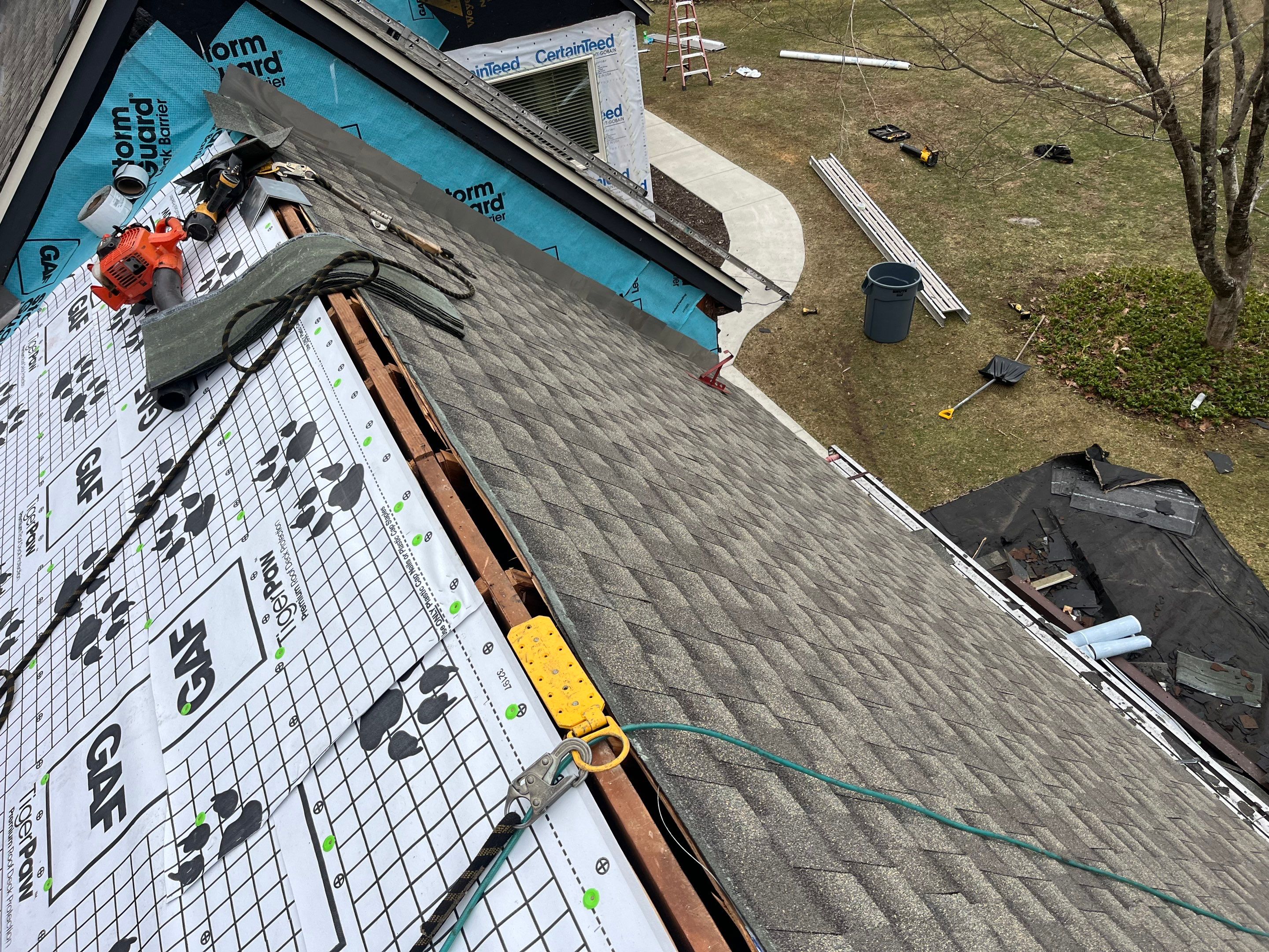 Asphalt shingles meet sleek siding in Guilford. by DiGiorgi Roofing and Siding Inc