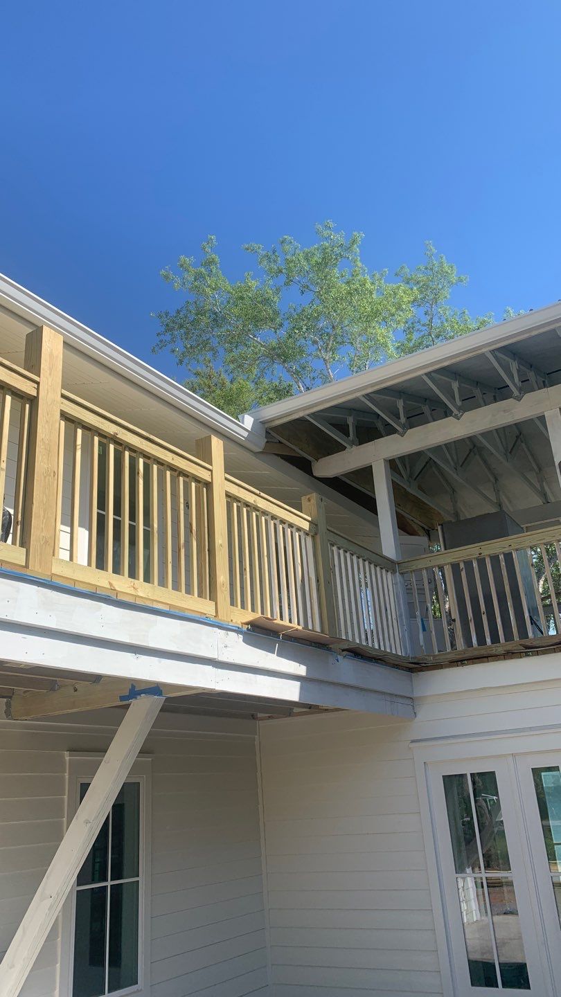 Seamless Gutter Installation Using White K-Style Aluminum Gutters by Gutter Professors