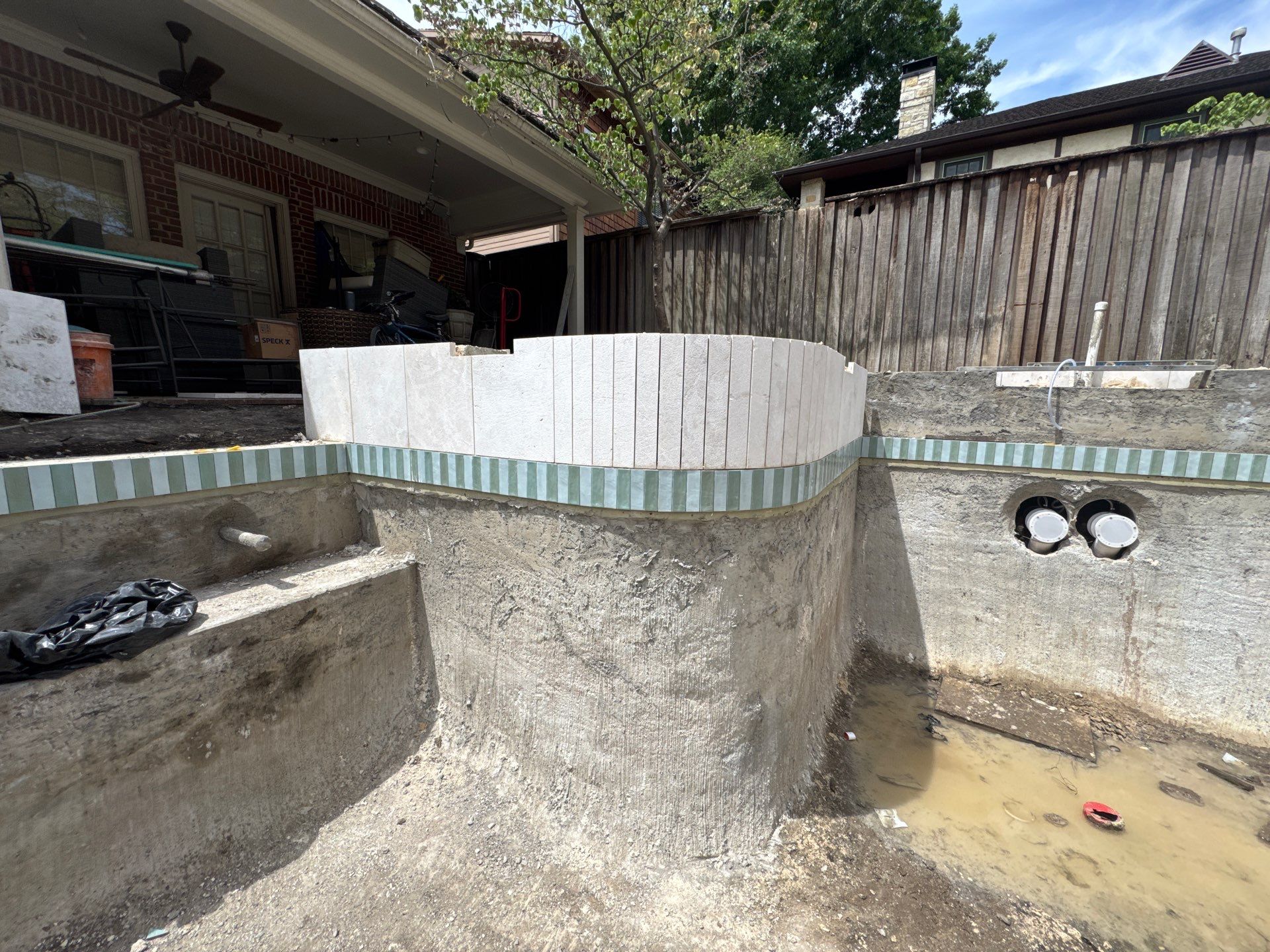 Modern Geometric Pool with Raised Spa and Travertine Deck by Pinnacle Pools and Spas - DFW