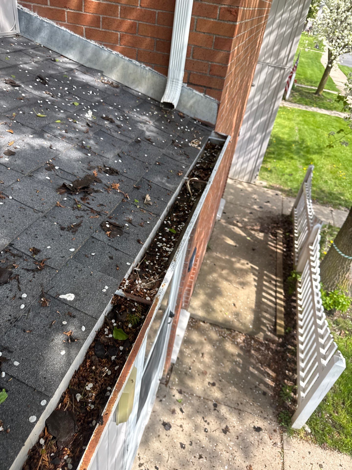 Commercial gutter cleaning Syracuse before photo with filled gutters