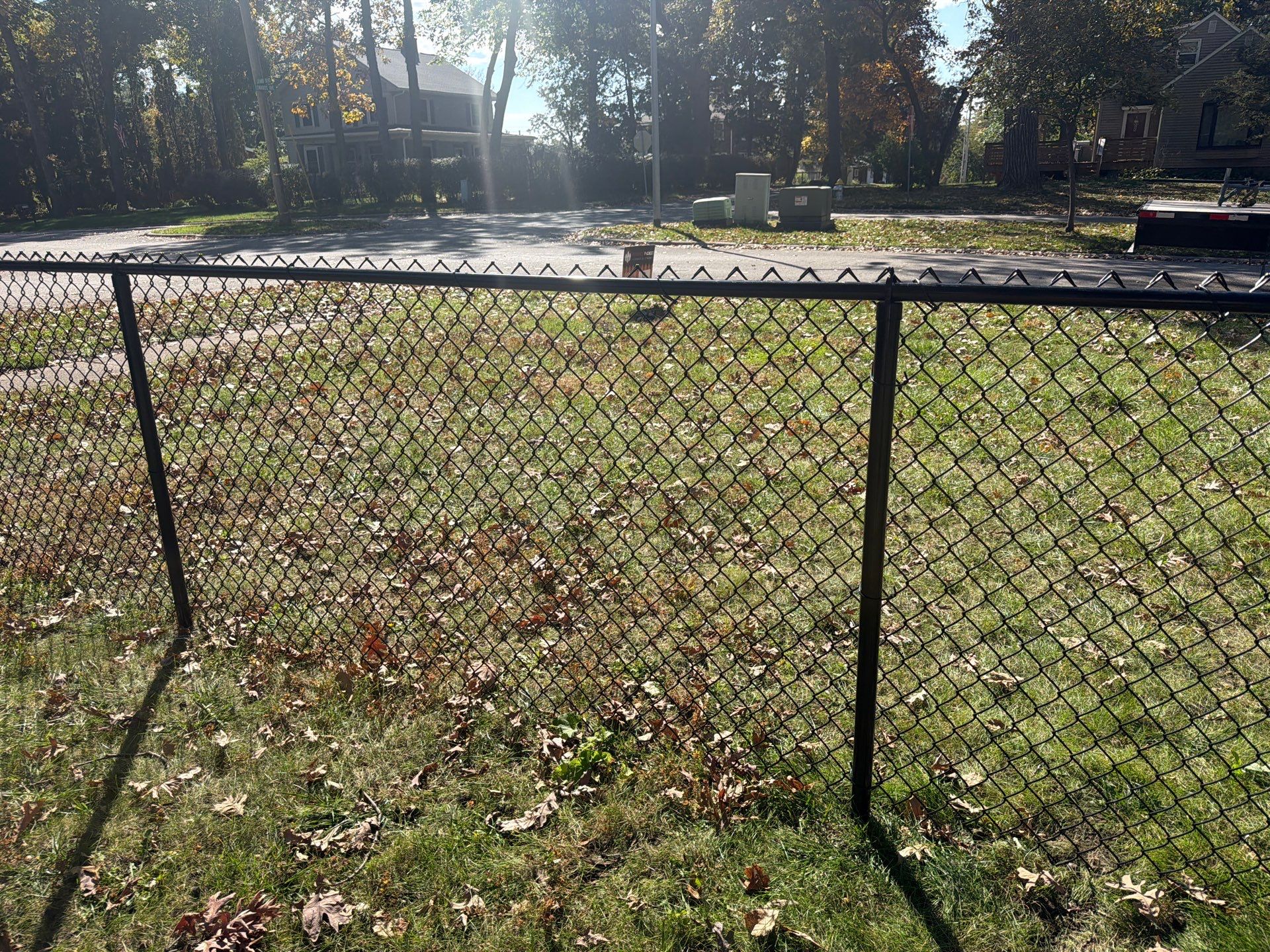 Residential Black Chain Link Fencing in Cedar Falls by Perfect Picket Fence and Stain
