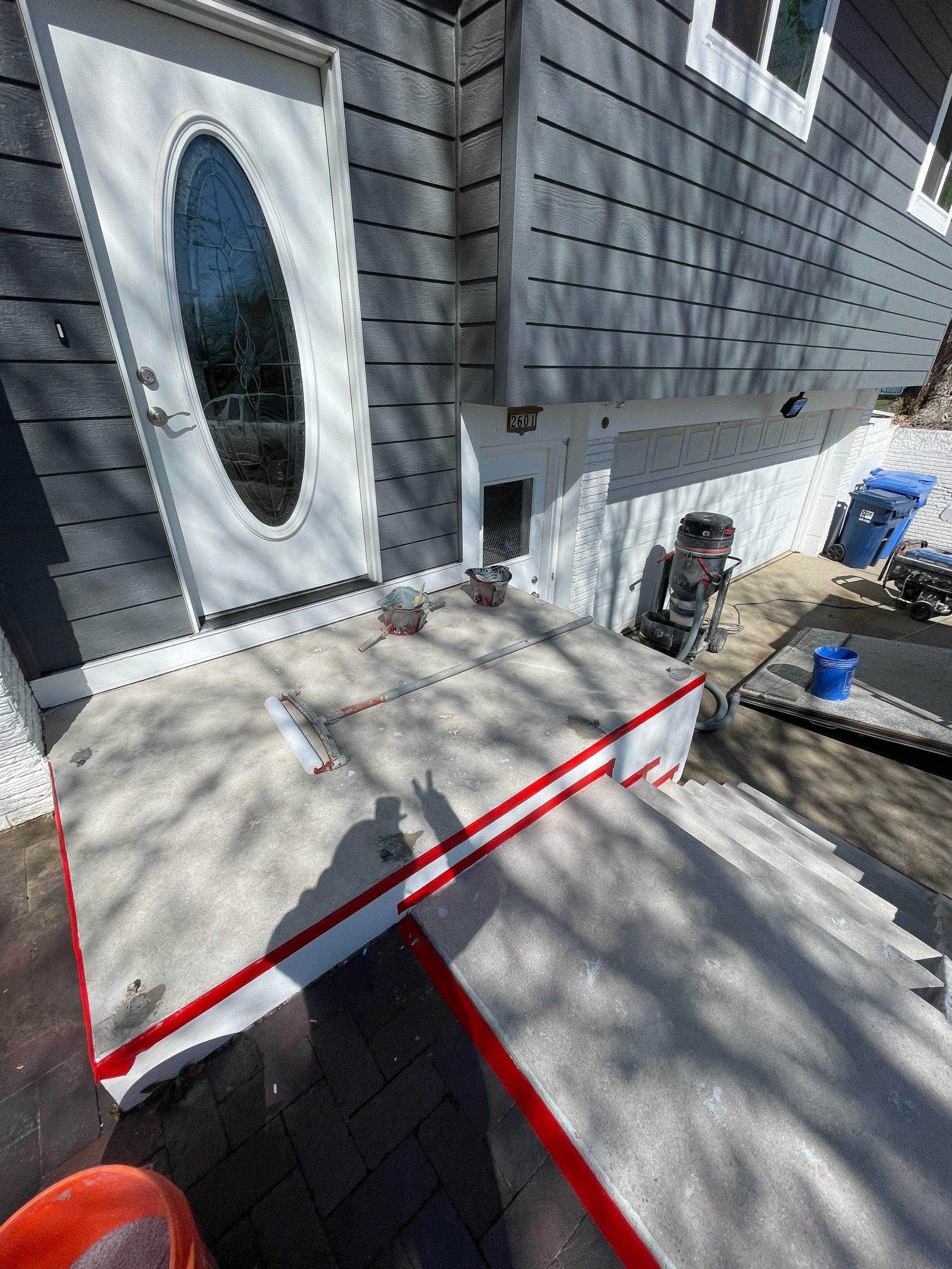 Grey Polyaspartic Porch and Stair Resurfacing in Sioux Falls by Select Painting, Coatings & Garage Cabinets