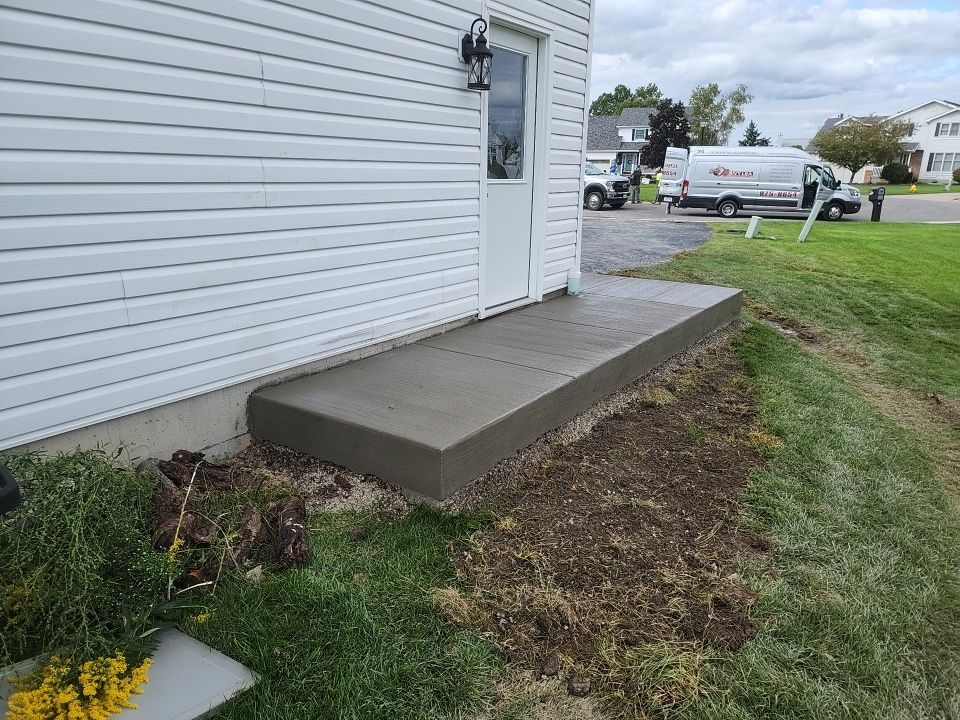 Stamped Concrete and Entry Door by Ivy Lea Construction