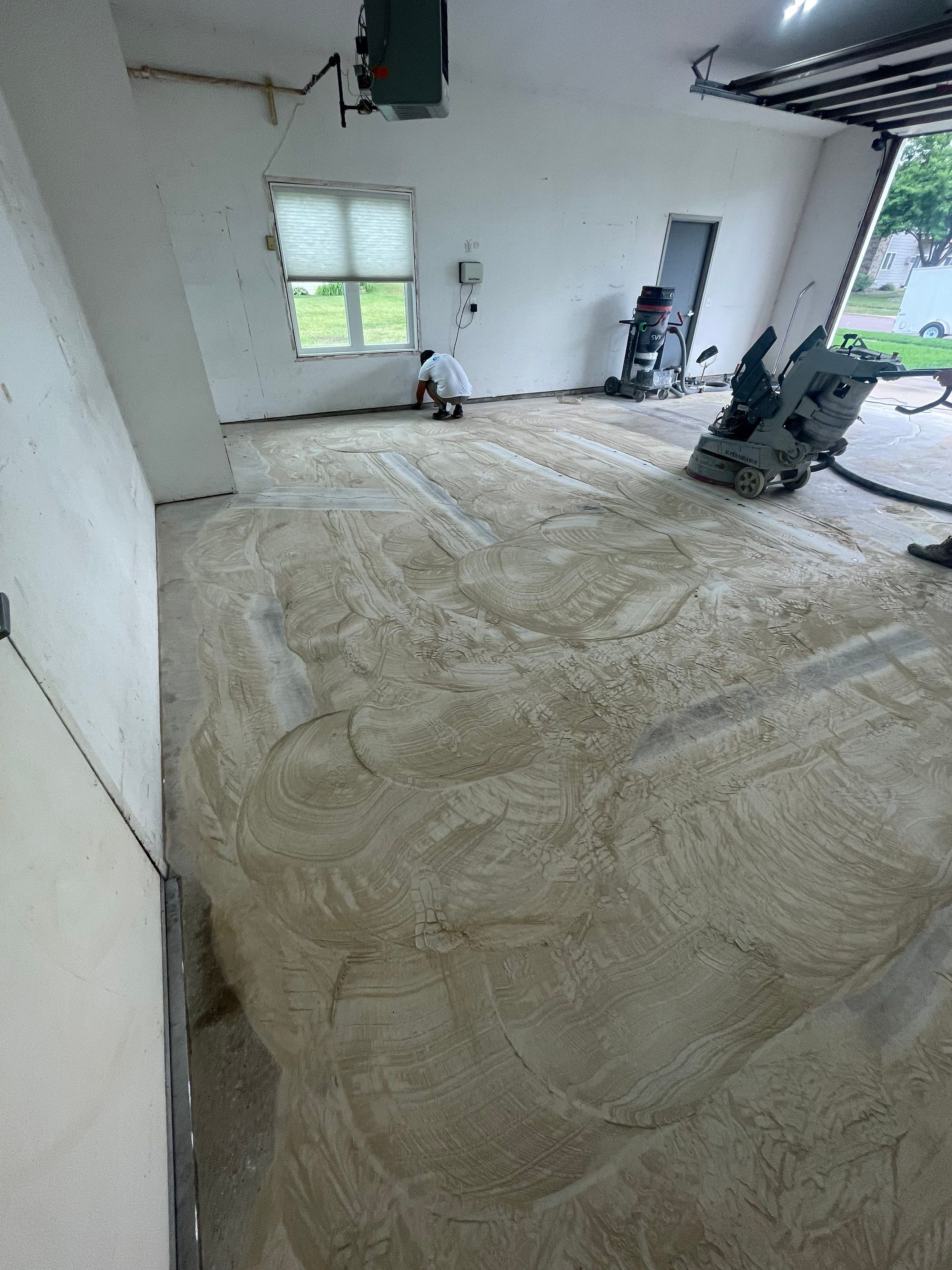 Coyote Flake Concrete Coating for Sioux Falls Garage by Select Painting, Coatings & Garage Cabinets