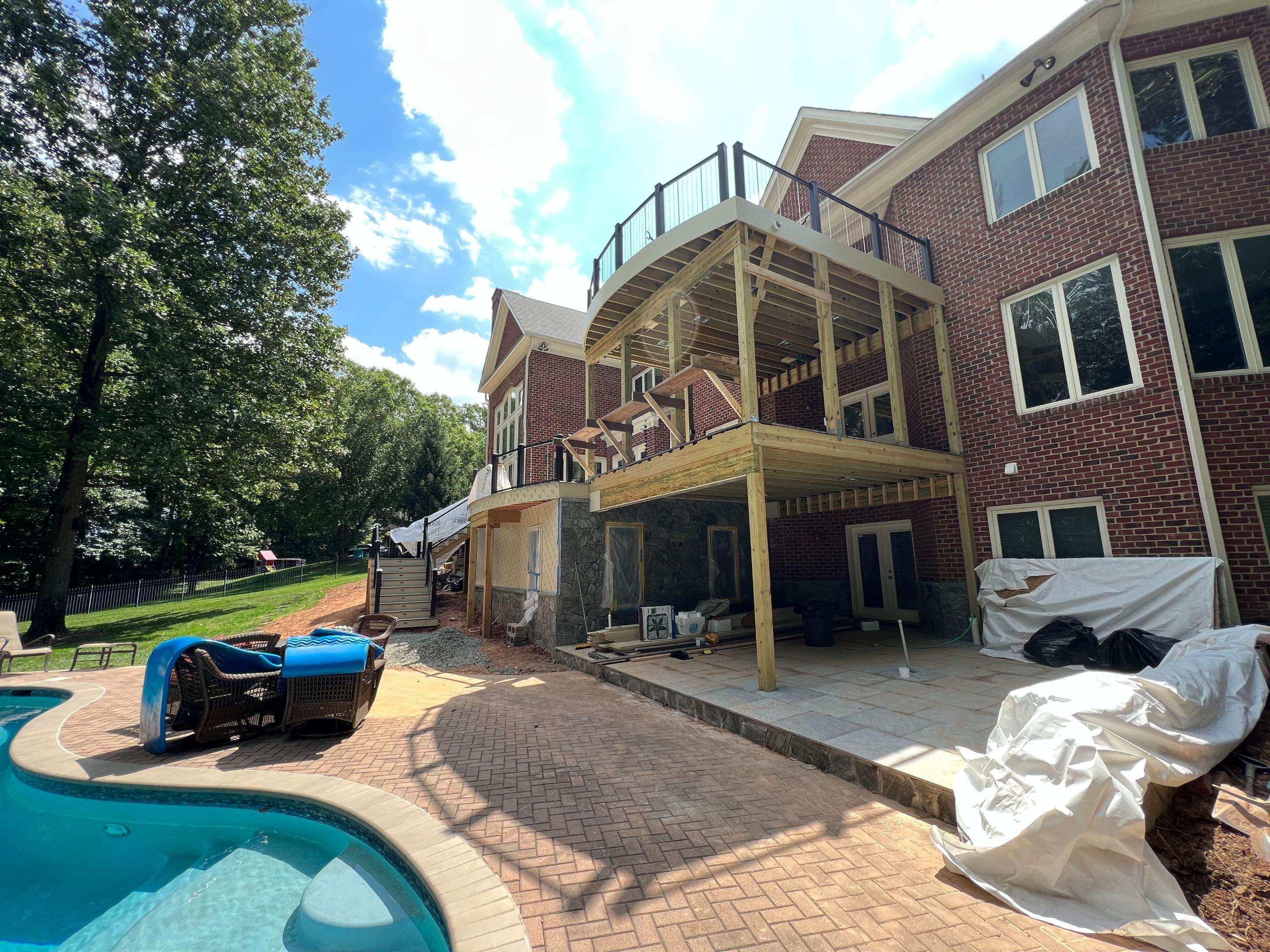 Custom Multi-Level Deck, Outdoor Kitchen & Pool Patio in McLean, VA by Sunburst Construction Inc