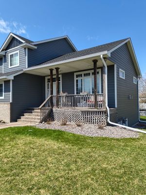 6” White Gutters & LeafBlaster Pro on 3-Story Home in St. Michael MN |