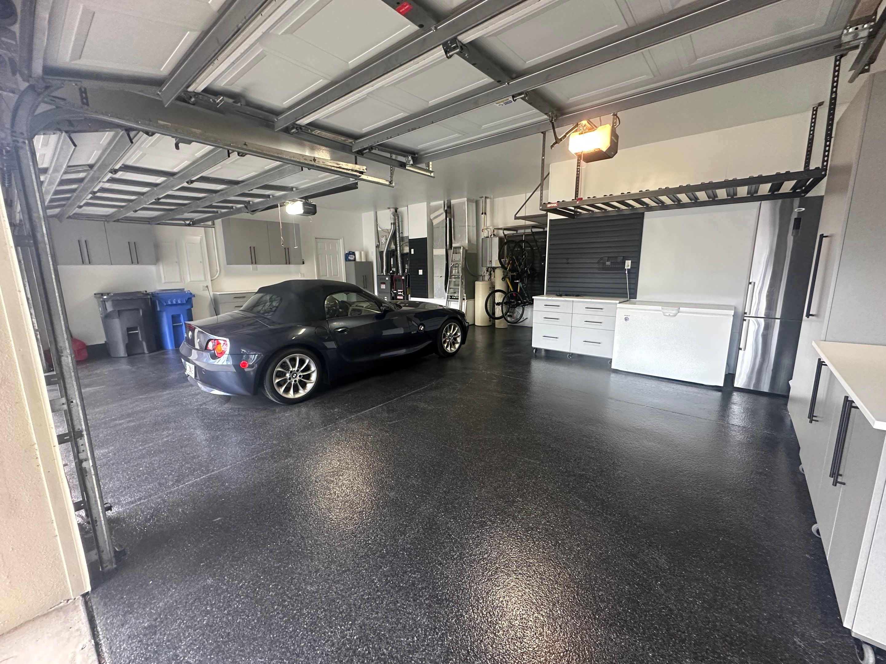 Tampa Garage Floor Coating and Overhead Storage Rack Installation by Square 1 Garage and Closet Solutions