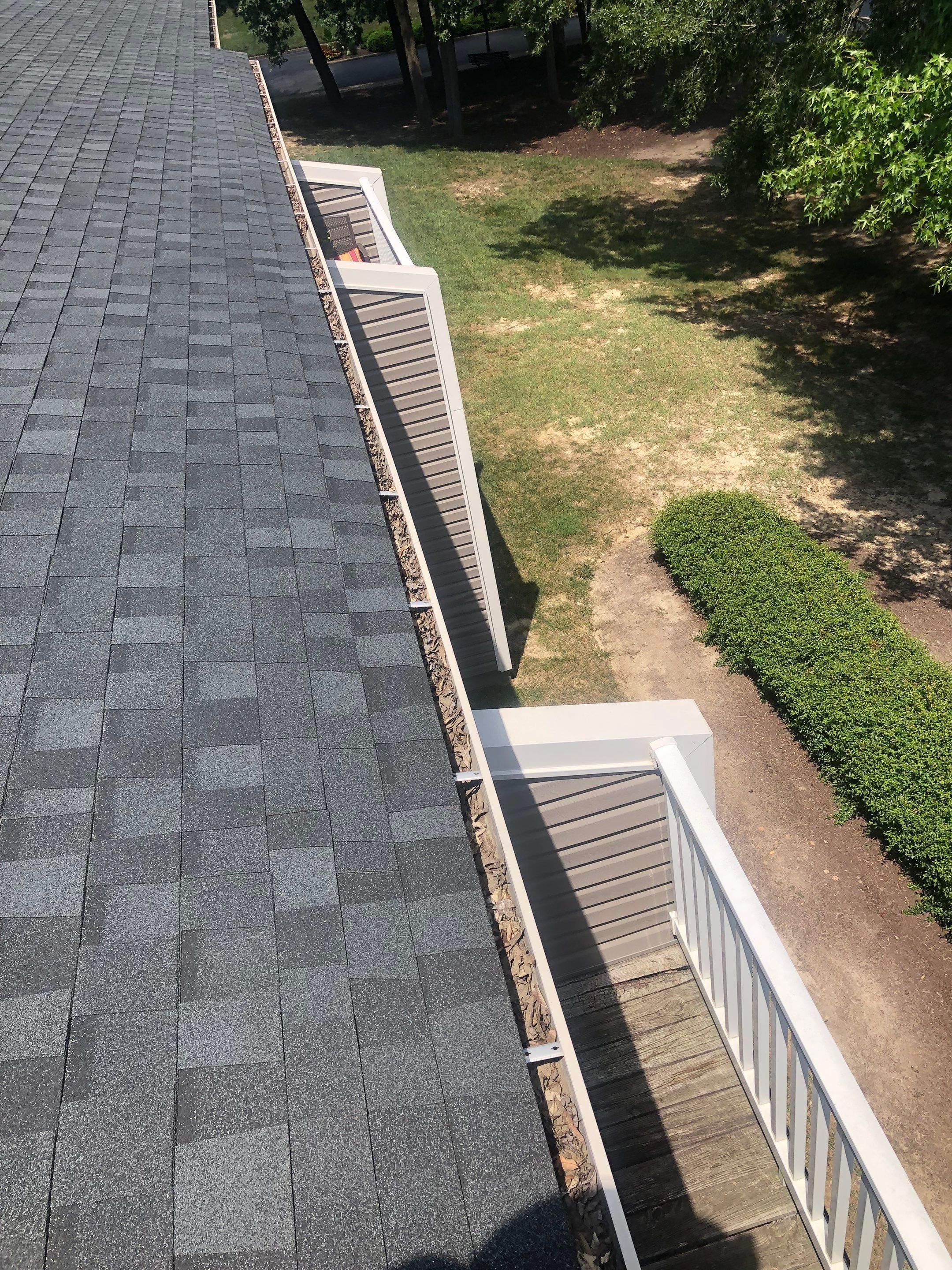 Commercial gutter cleaning Richmond before photo with filled gutters