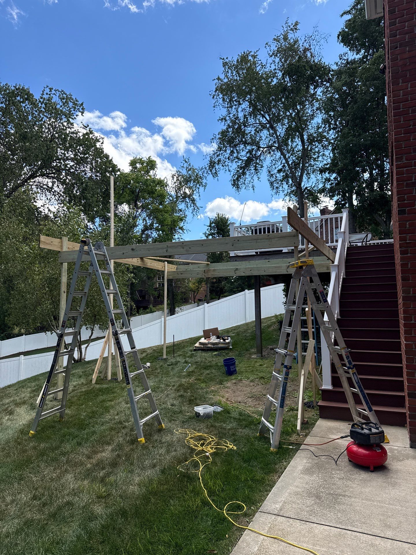 Deck extension  by Cousins Roofing Siding & Decks