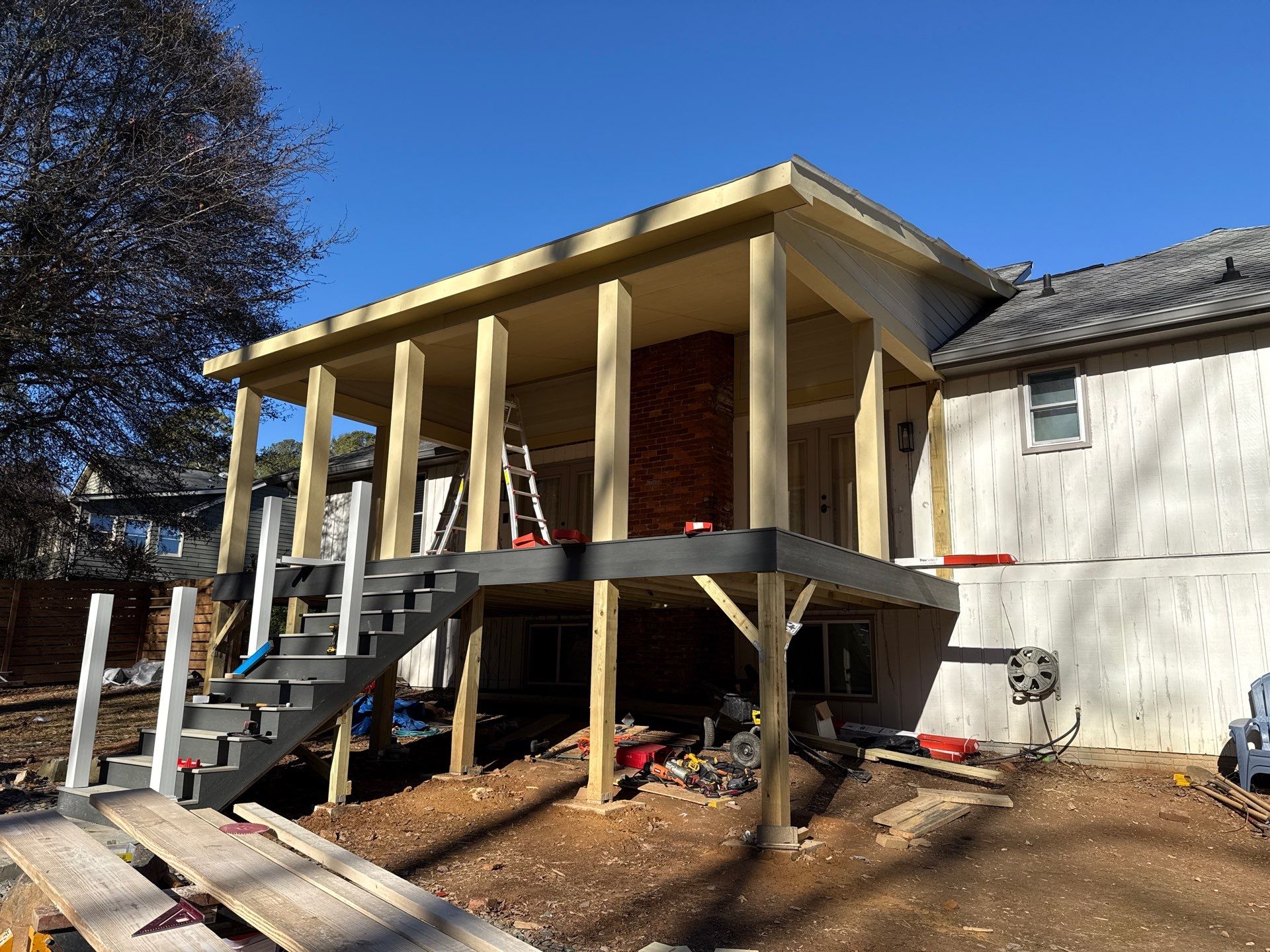 Deck and Shed Roof Style Covered Build using Trex Decking Products by Nelson Exteriors 