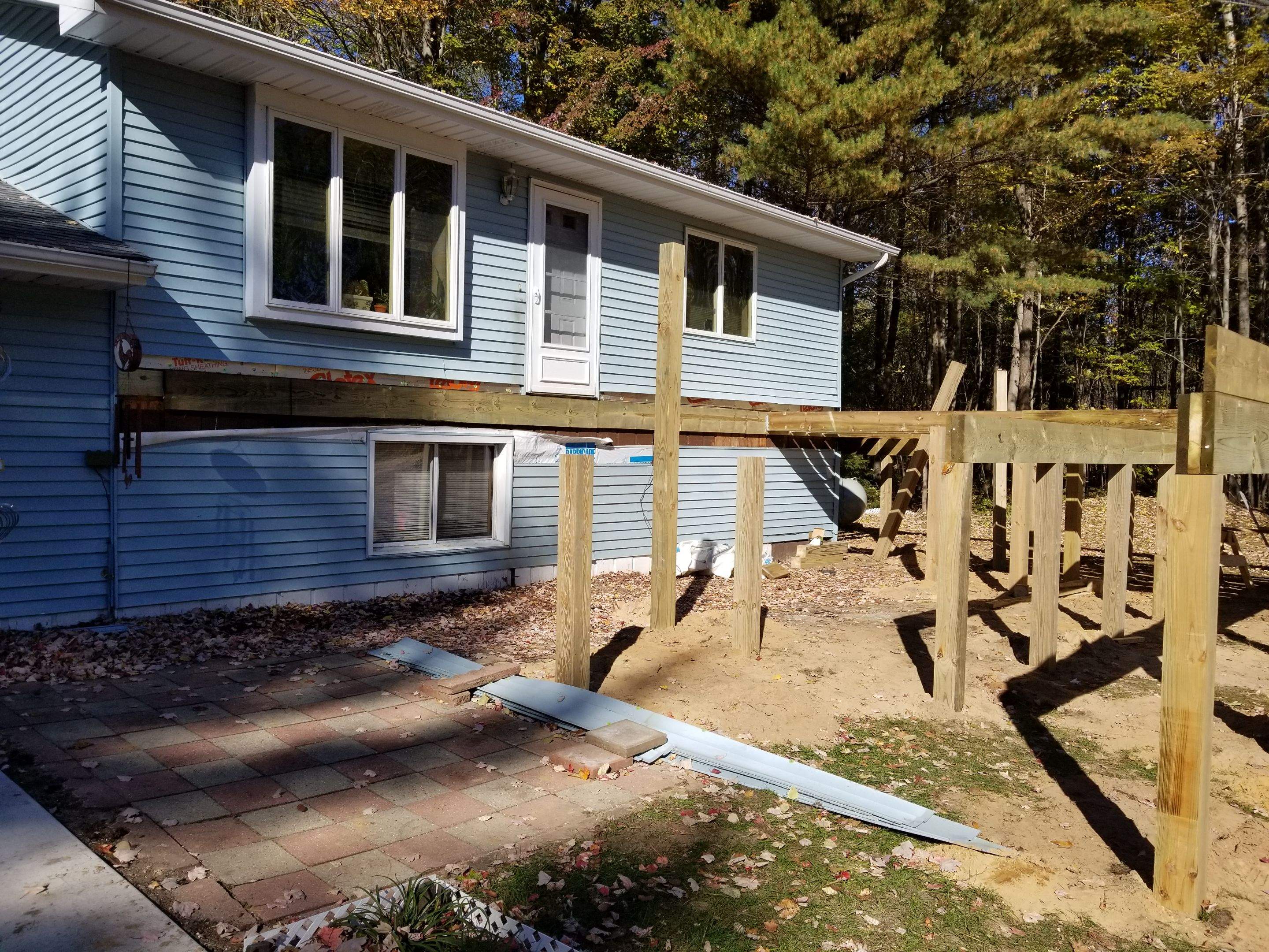 Sunroom and deck addition. by Energy Plus Home Improvements