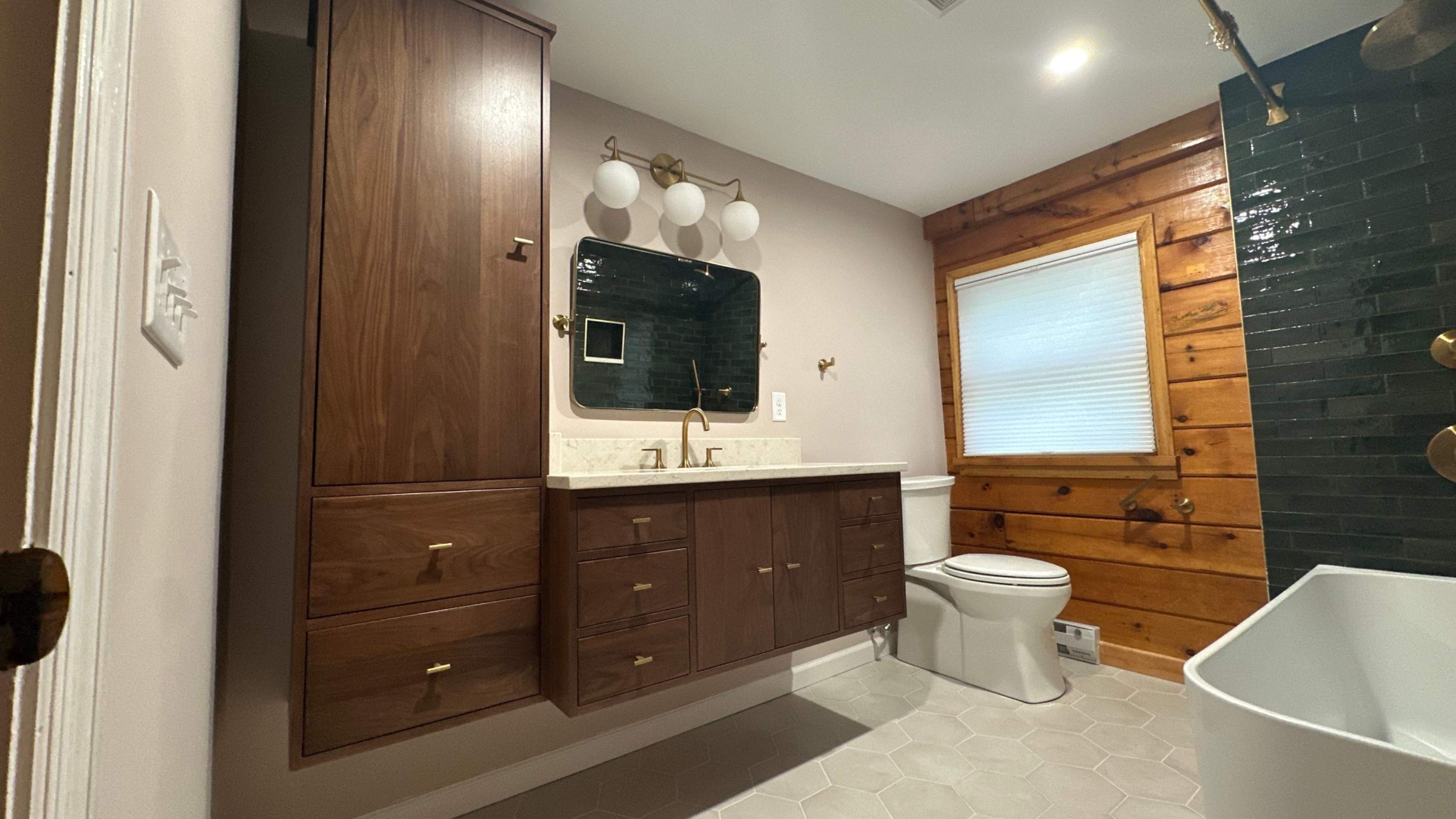 Brandt Double Bathroom Remodels by Integrity Tile and Home LLC
