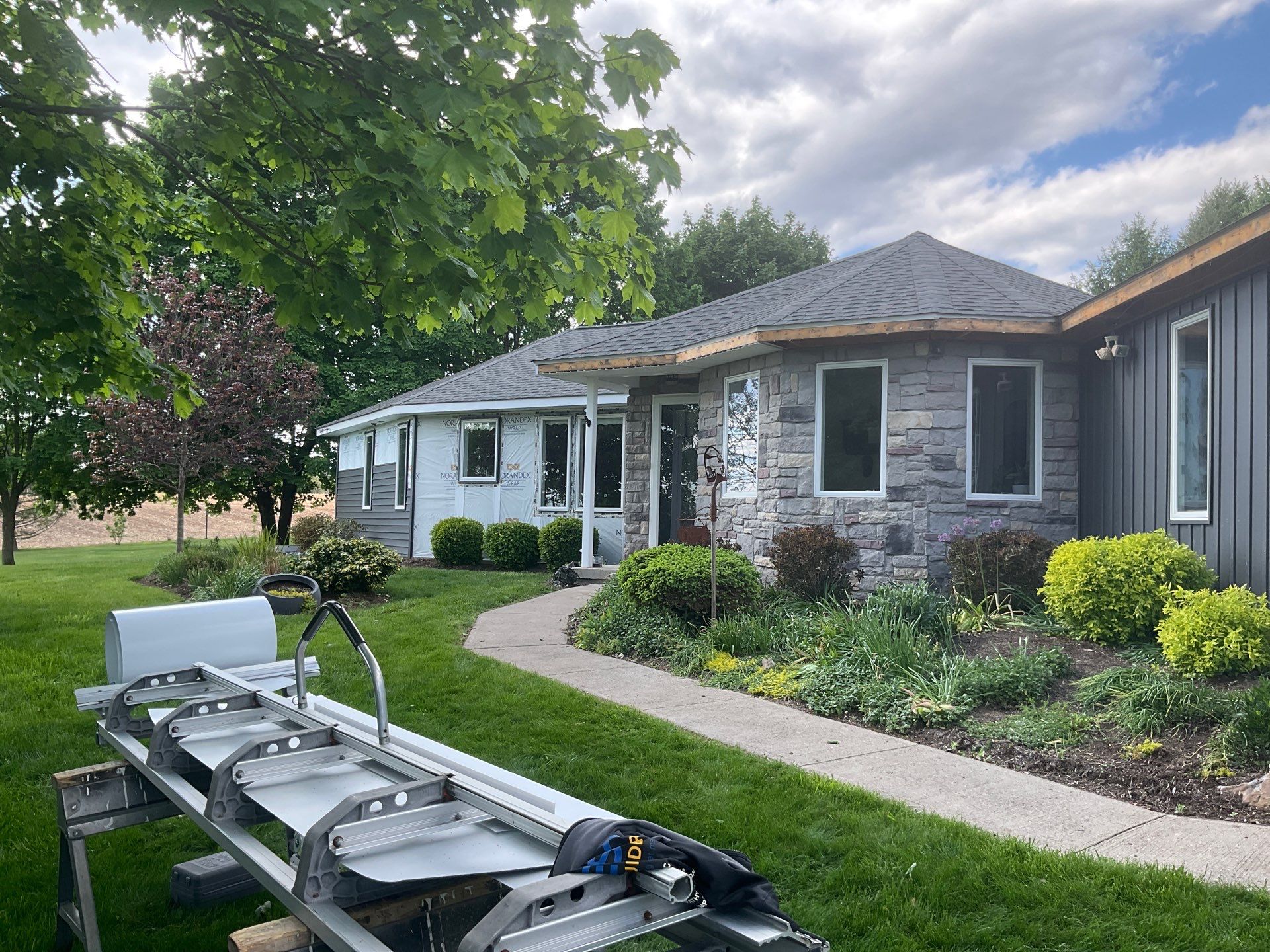 Nightfall Exterior Siding Replacement and Stone Veneer in Halifax by Esh Builders