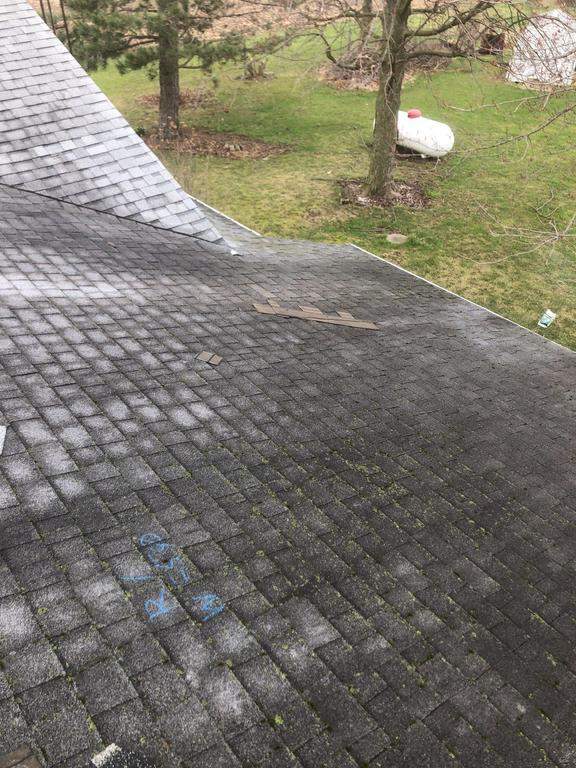 Storm damage roof replacement by Nitro Roofing and Construction