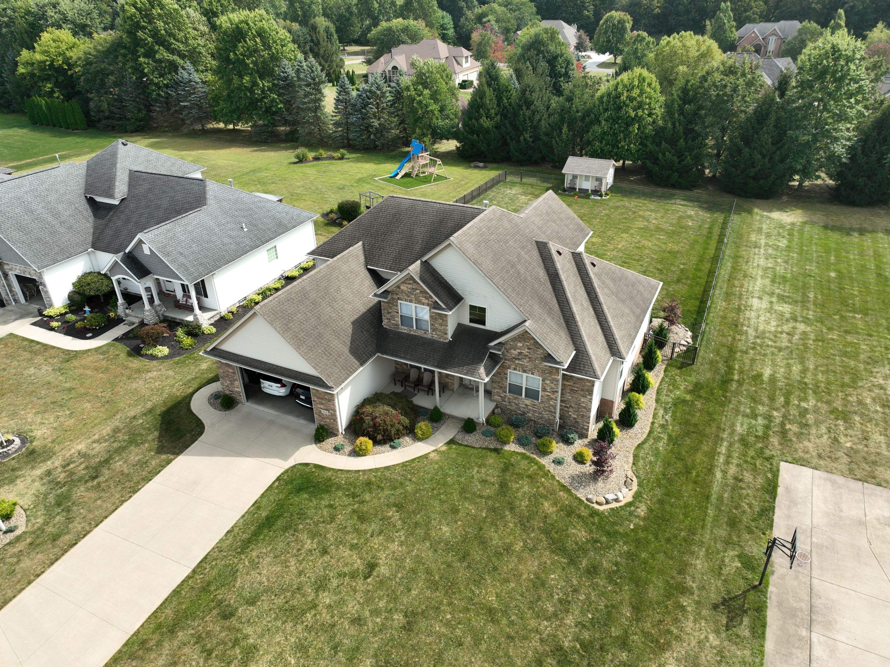 Timeless in Teak: Wooster Roof Revitalization by Cornerstone Roofing And Siding