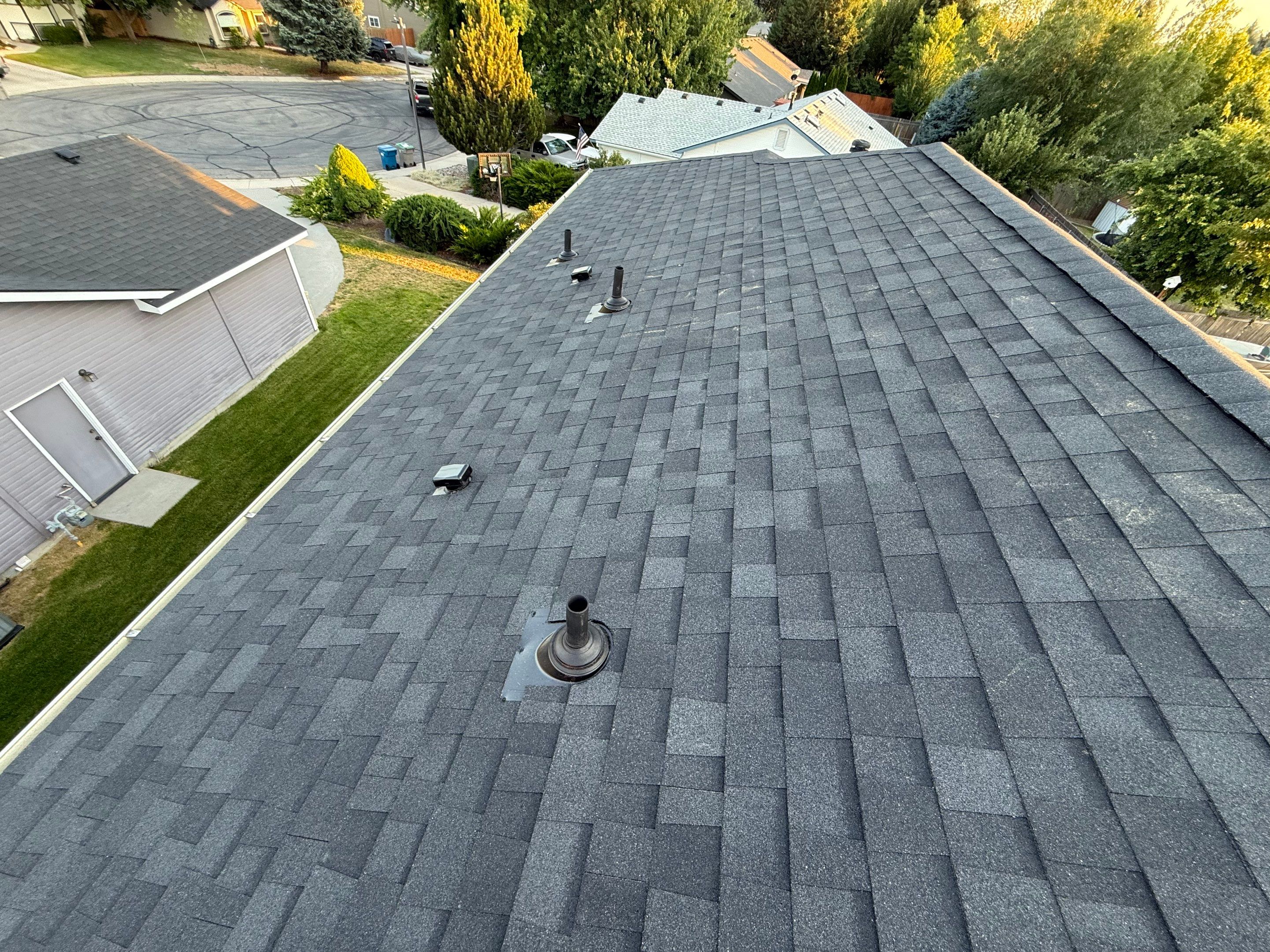 Residential Roof Replacement and Seamless Gutter Installation in Boise by Olive Roofing