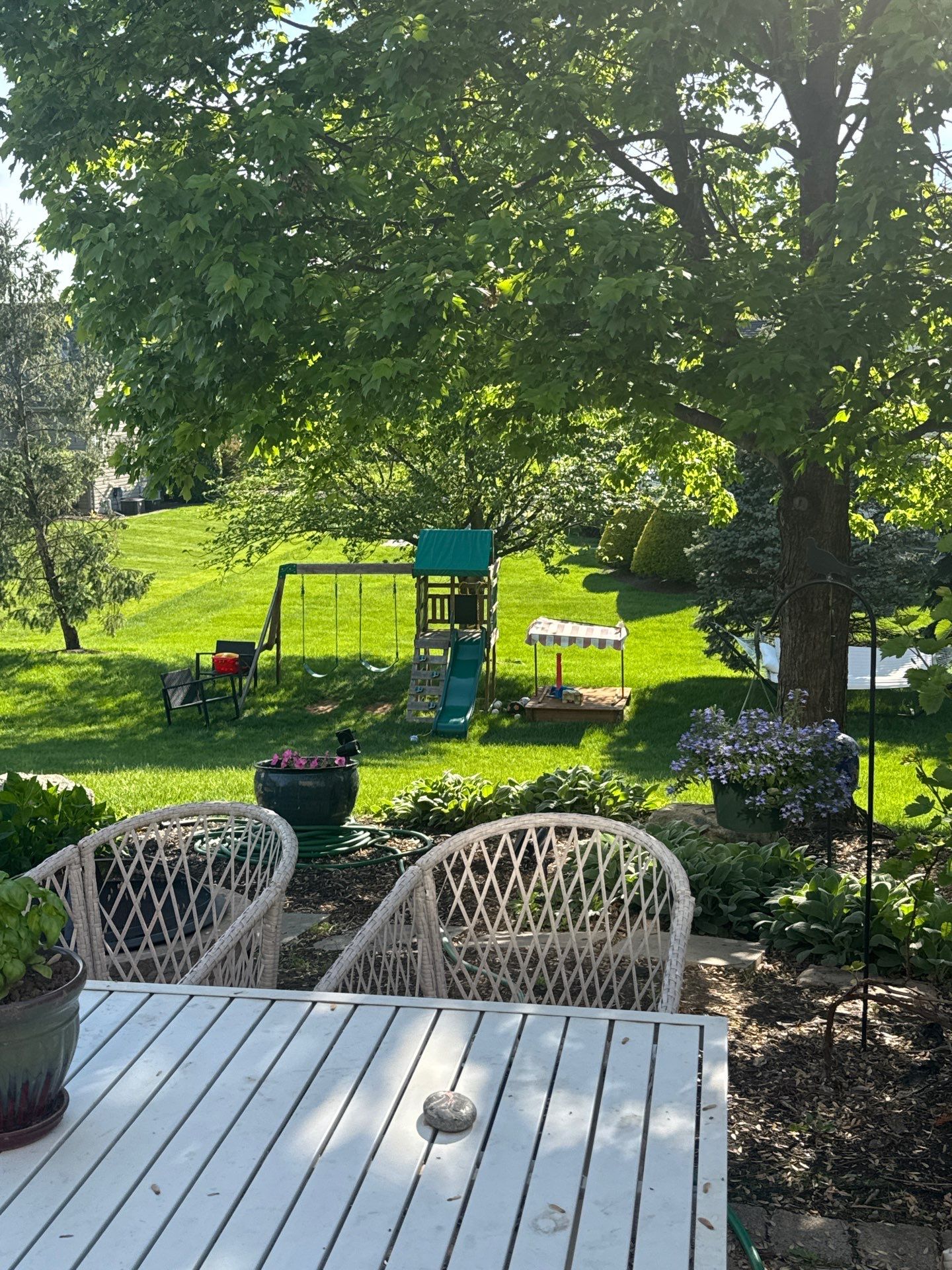 Backyard Retreat: Techo-Bloc Patio + Firepit Lounge by Saylor’s Lawn & Landscape