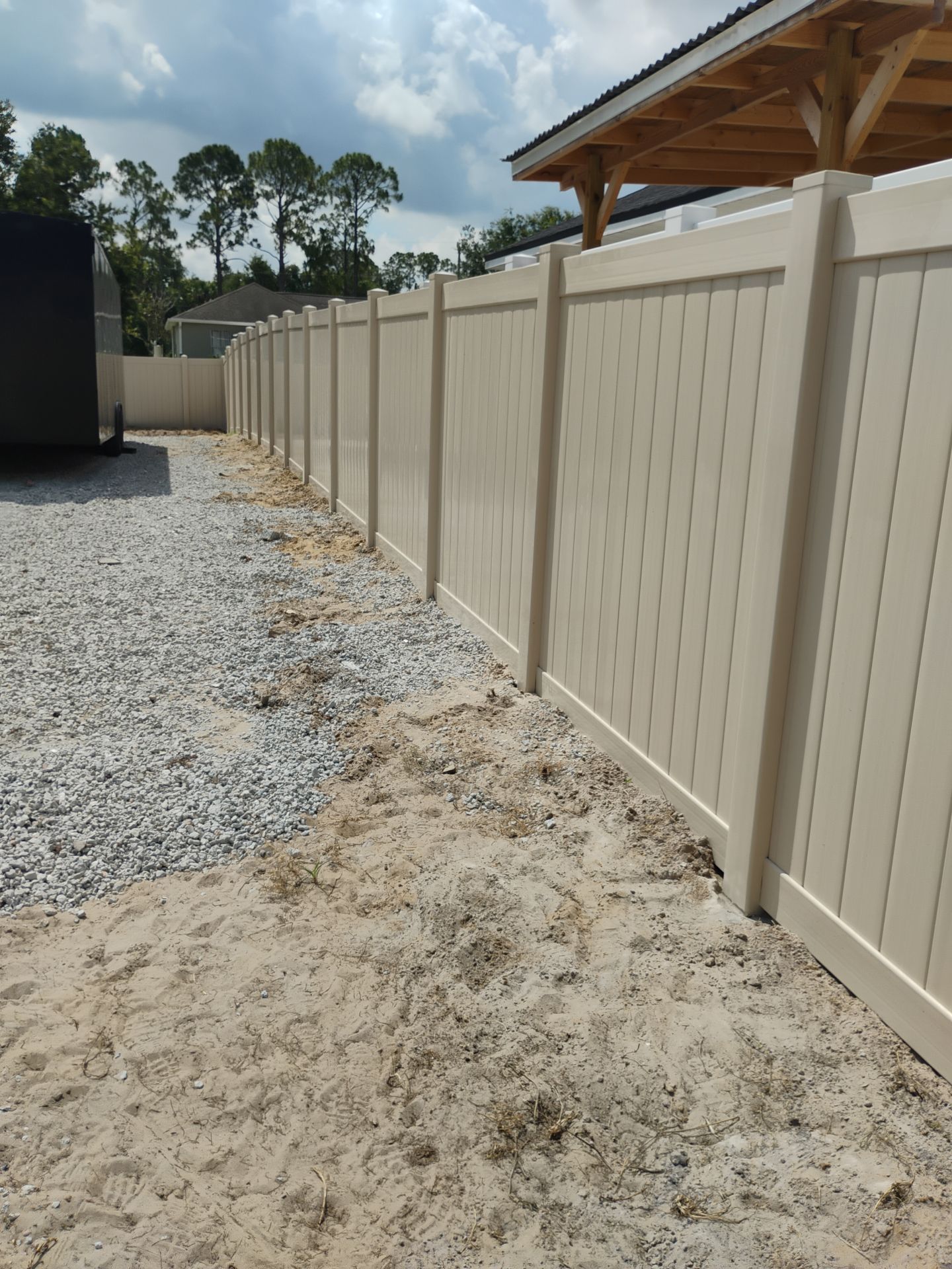 Tan Vinyl Privacy Fence and Gate Installation in North Port by True Fence LLC