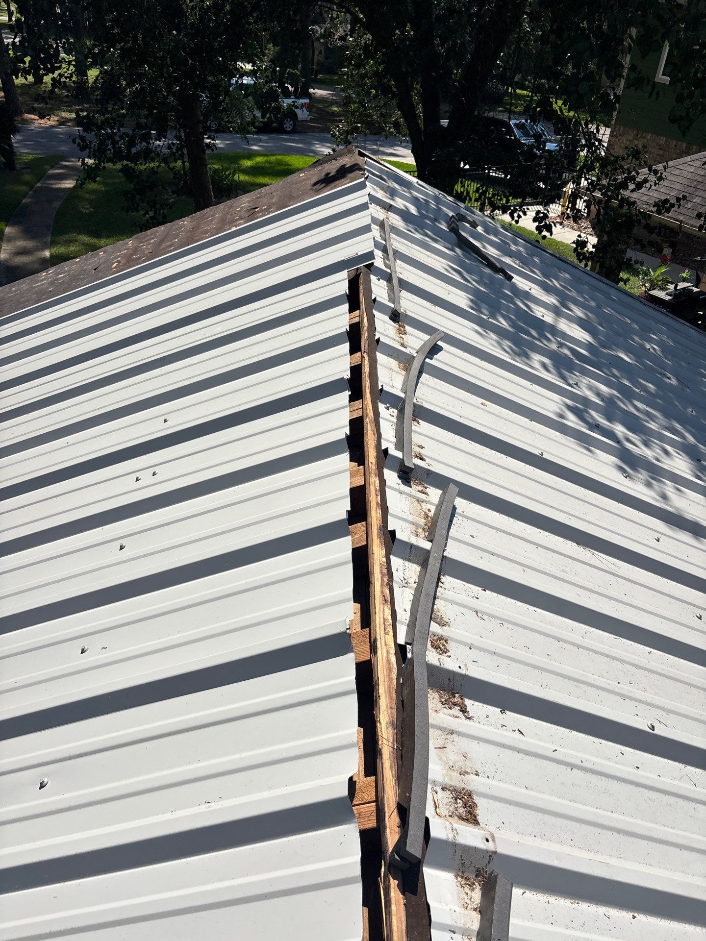 White Standing Seam Metal Roof Replacement in Willis, Texas by Abbott Roofing Company