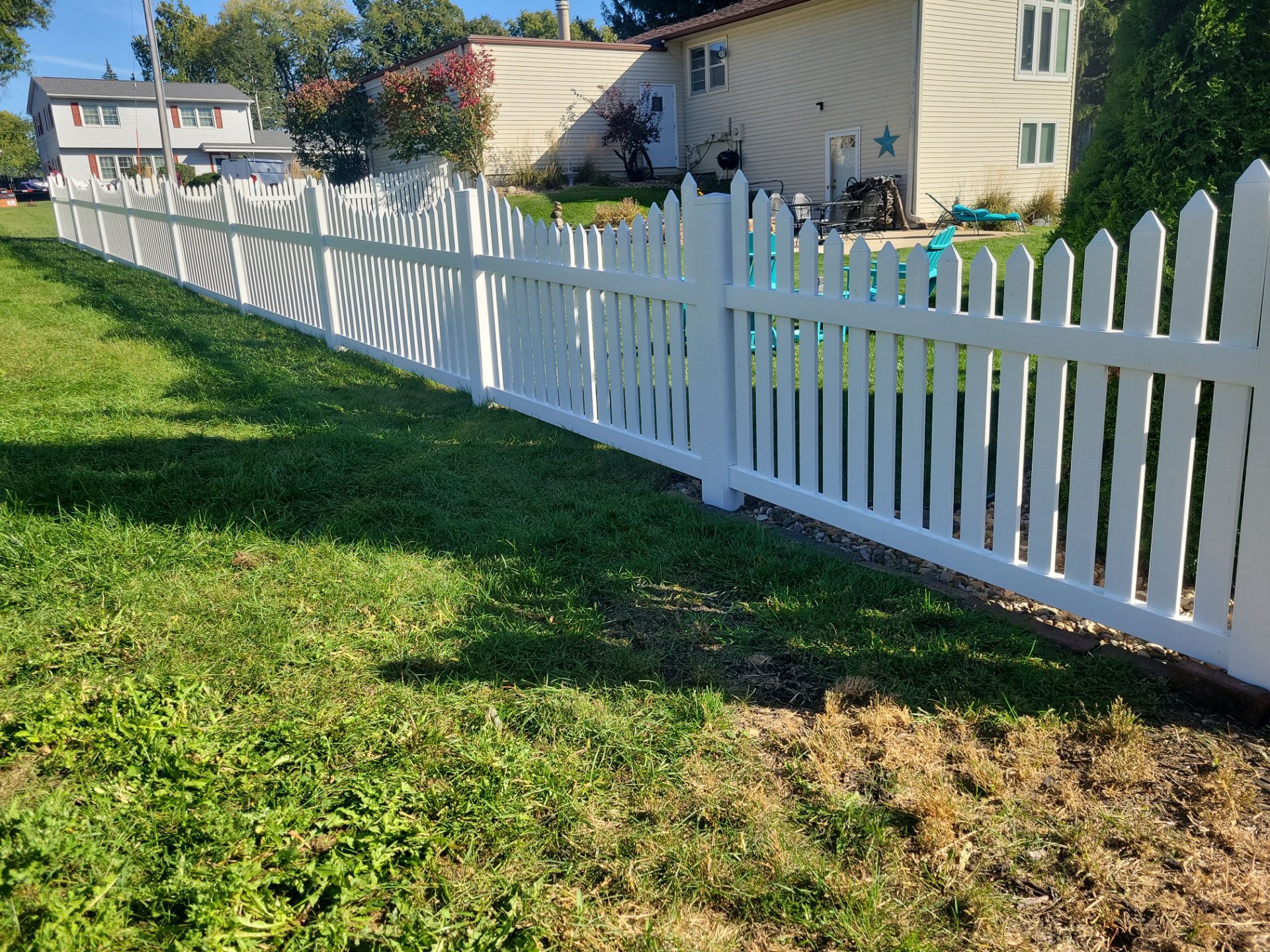 White Vinyl Spaced Picket Fence Installation in Waterloo by Perfect Picket Fence and Stain