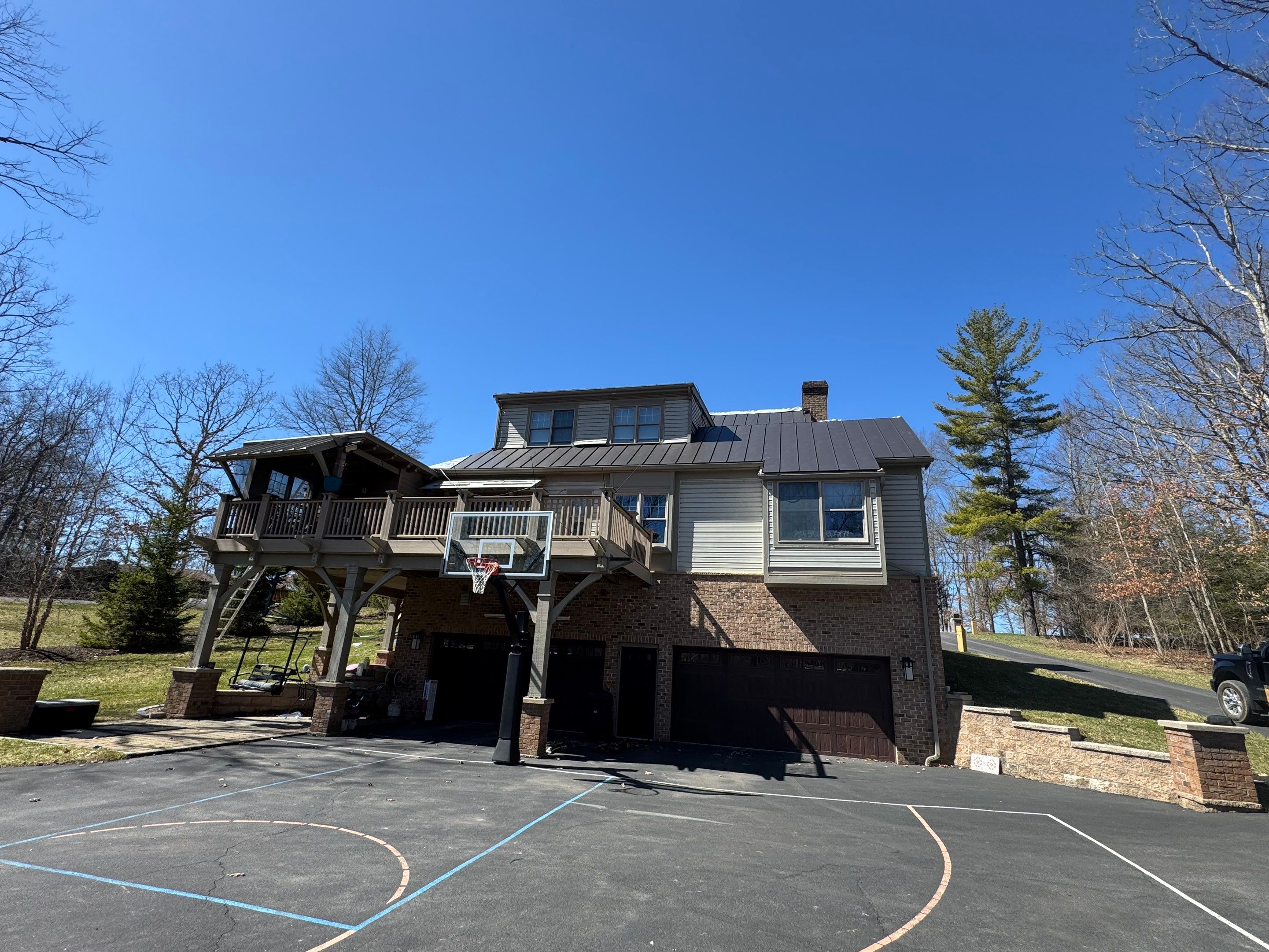 Metal Roof Replacement  by American Home Contractors