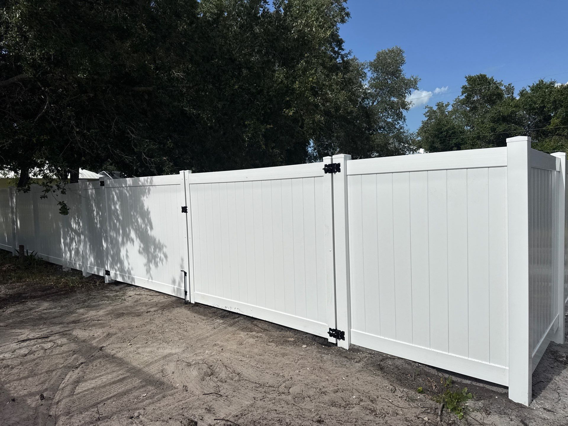 White Vinyl Privacy Fence Installation and Gate Assembly in Punta Gorda by True Fence LLC