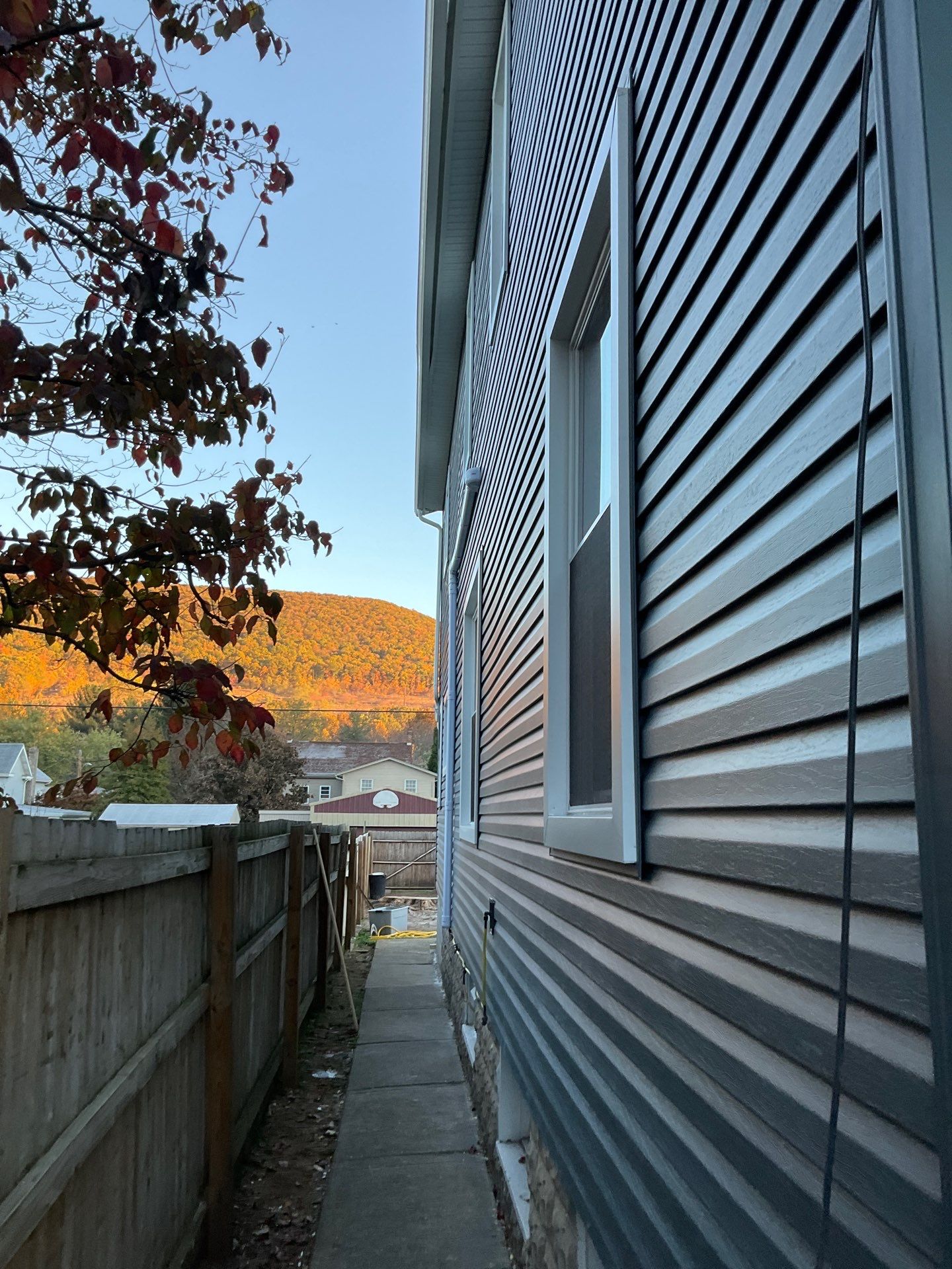 Charcoal Metal Roof & Blue Siding — A Refreshing New Look by Esh Builders