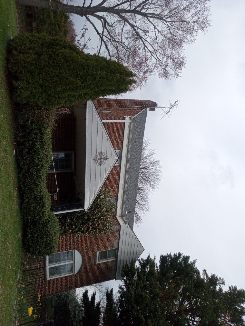 Onyx Black Shingles by Reimagine Roofing