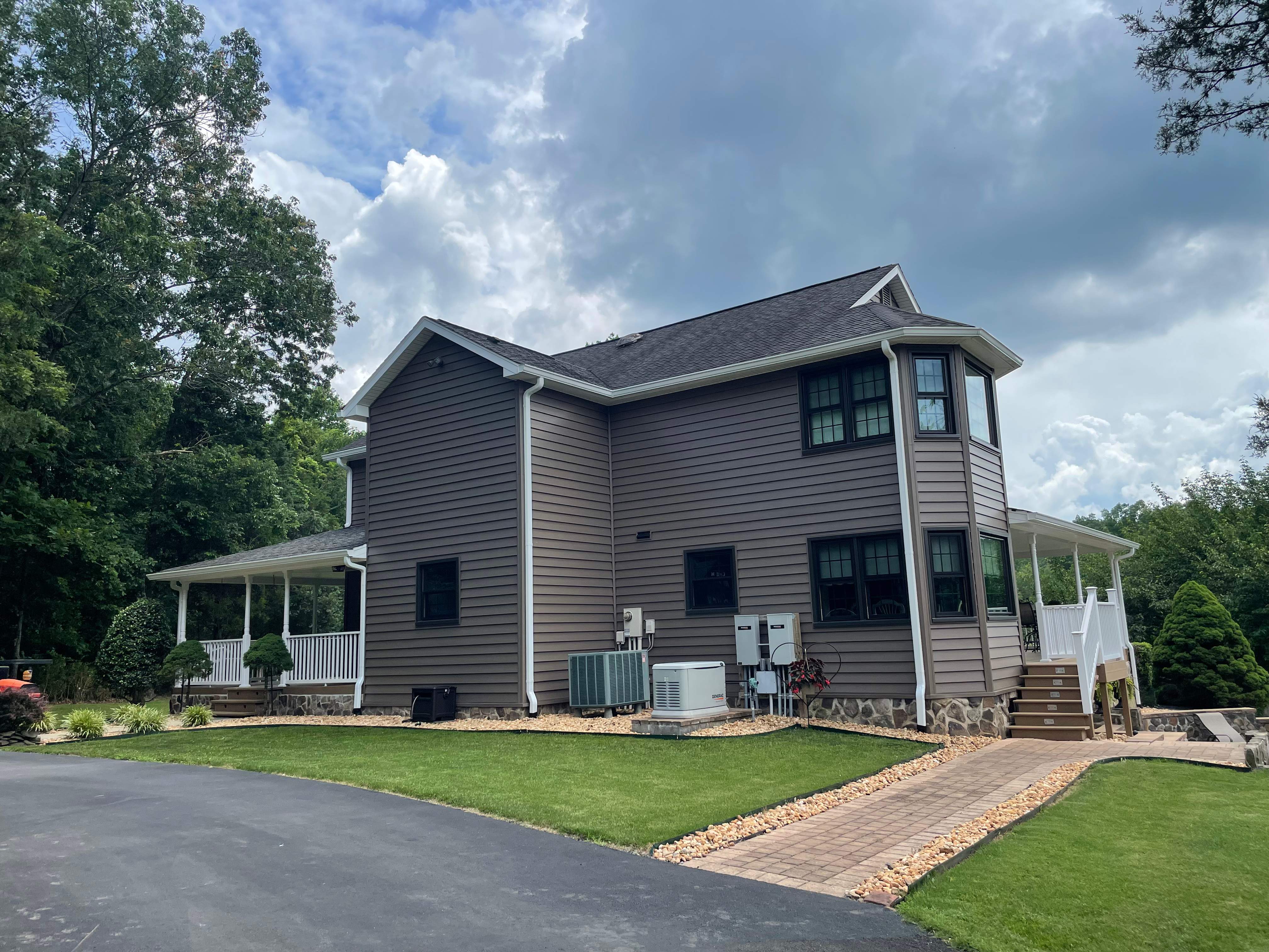 Exterior remodel including window replacement by American Home Contractors