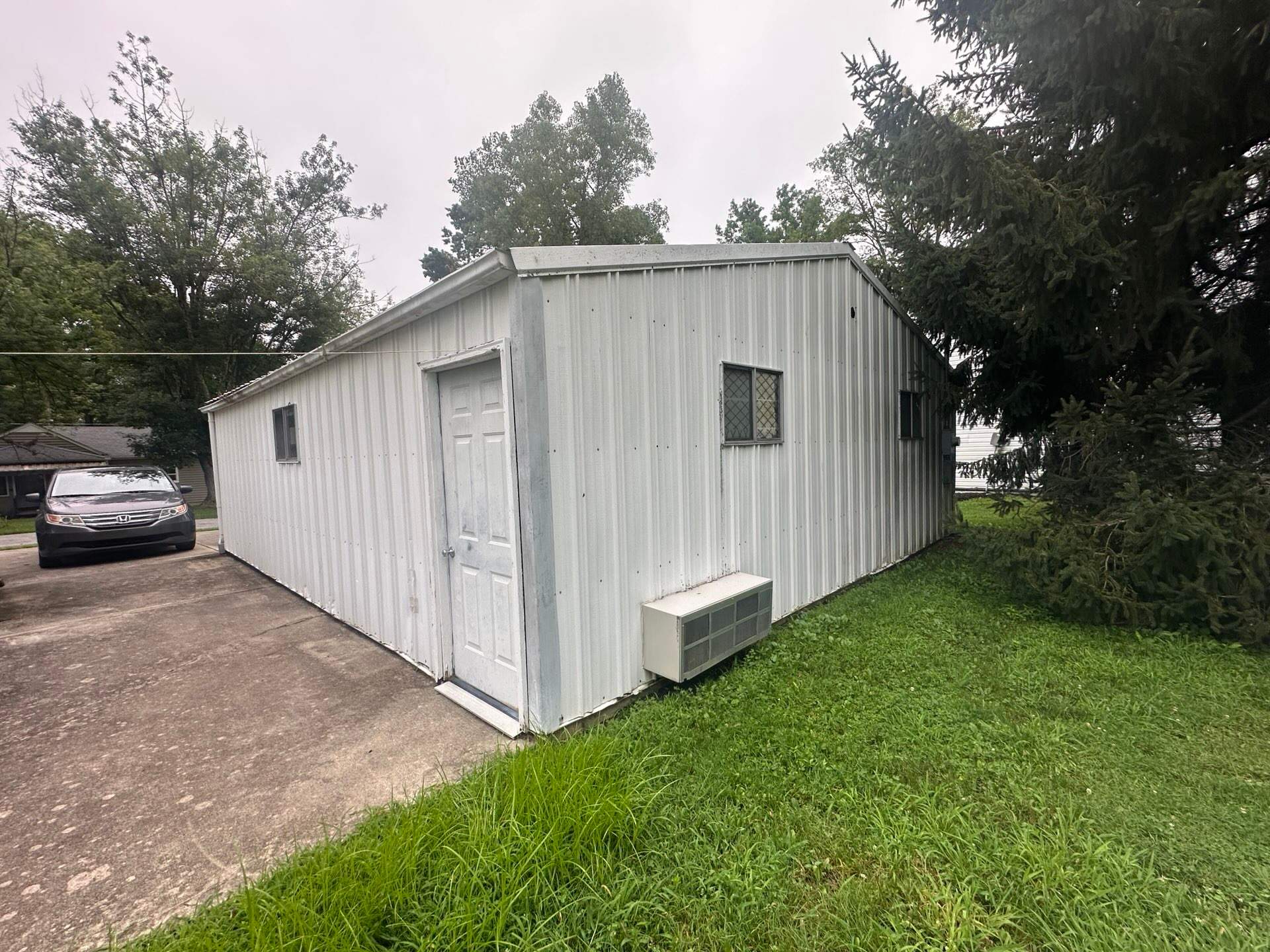 Green Metal Roof Installation and Exterior Renovation in Thornville by Canopy Contracting