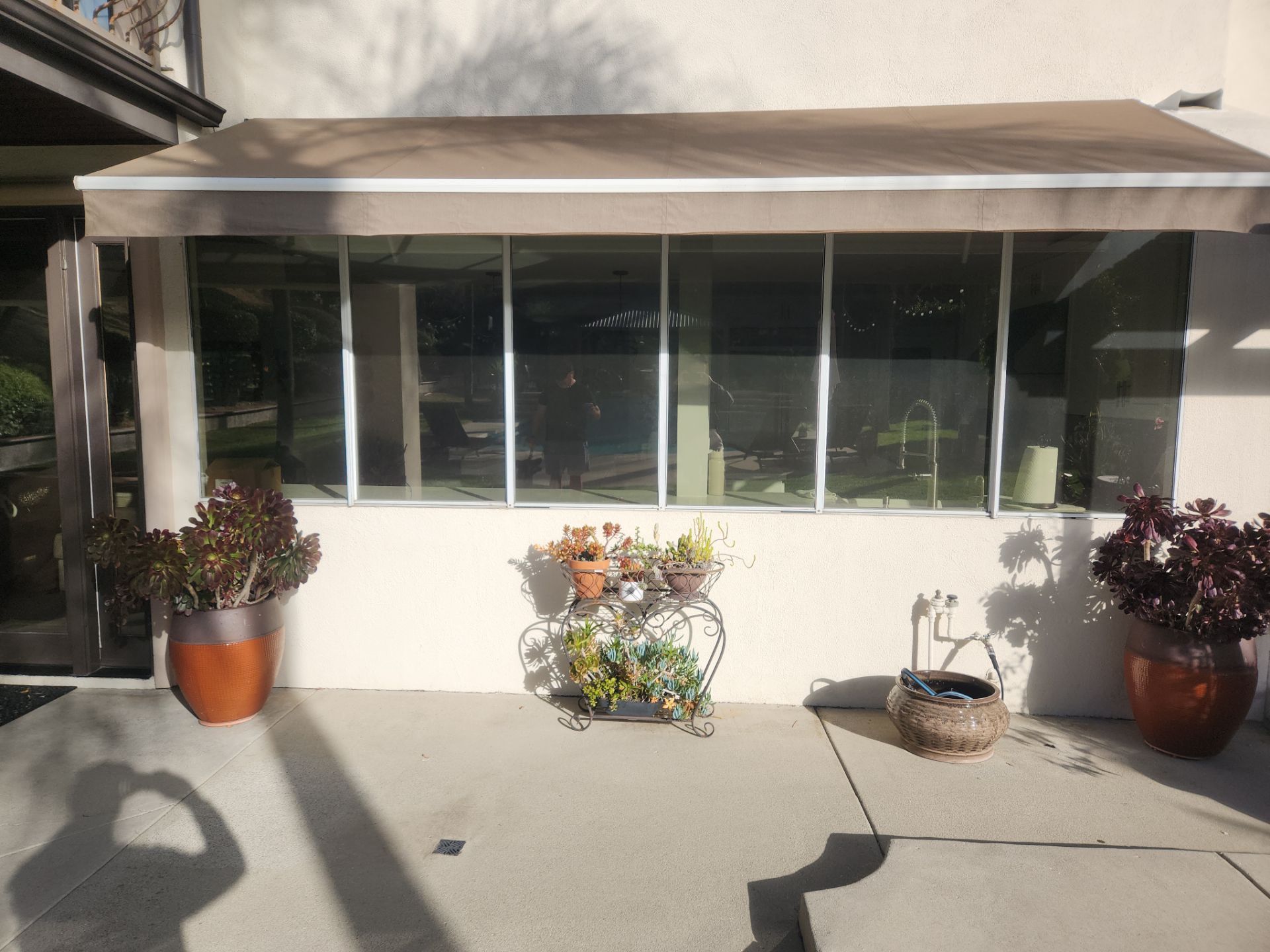Window Installation using Anlin vinyl windows with Sunshield glass by American Window Company