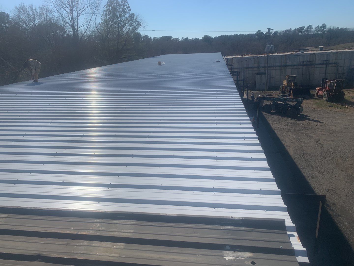 Commercial Roofing Installation using Aluminum Roofing panels by Hostetler Roofing