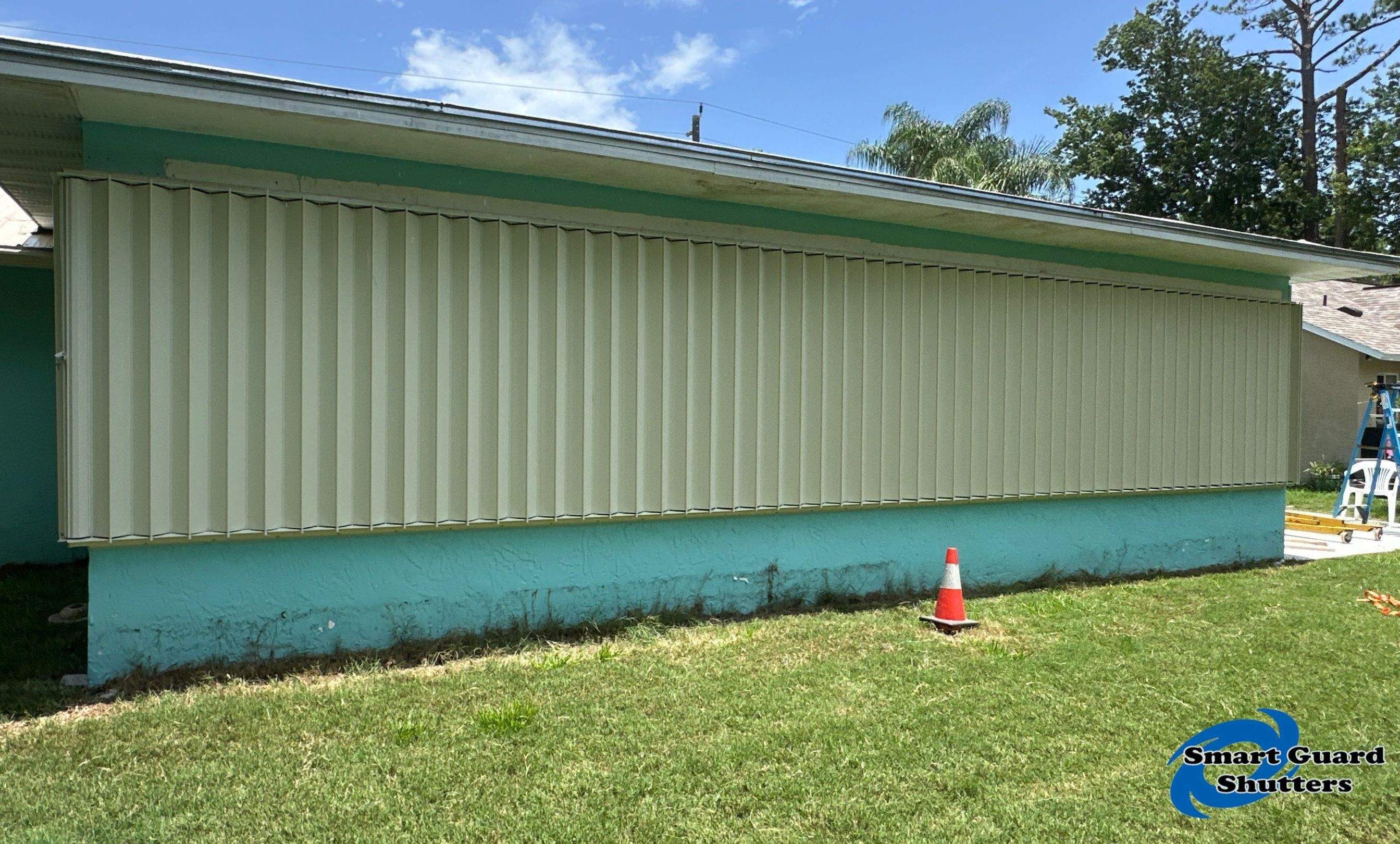 Accordion Shutter in Ivory by Smart Guard Shutters