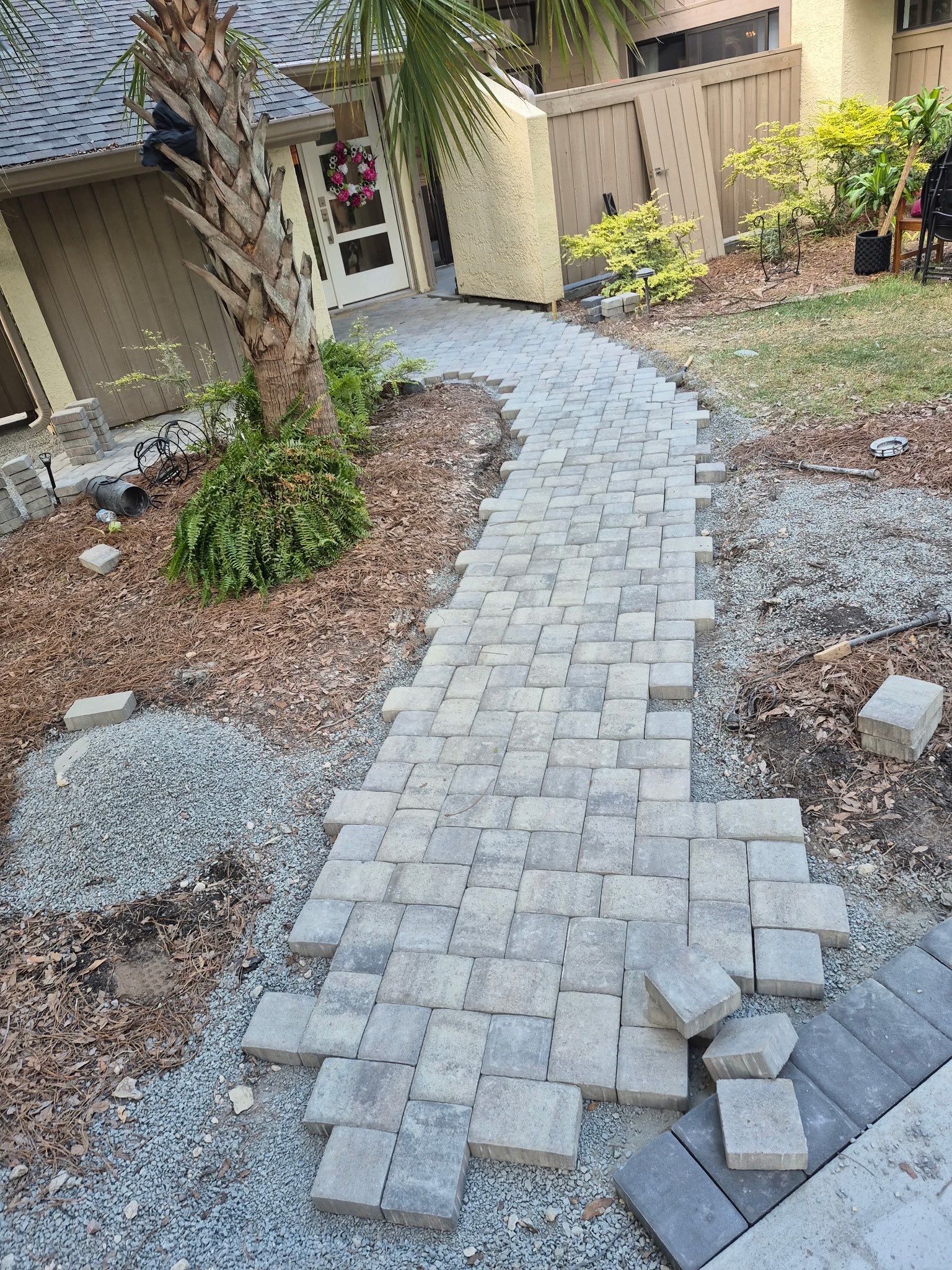 Custom Concrete Patio and Herringbone Paver Walkway in Hilton Head Island by Lowcountry Scapes, LLC